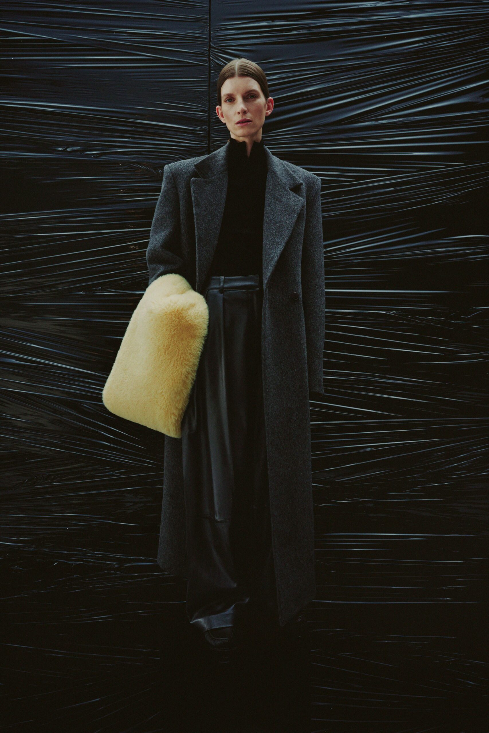 gray wool coat black top leather pants