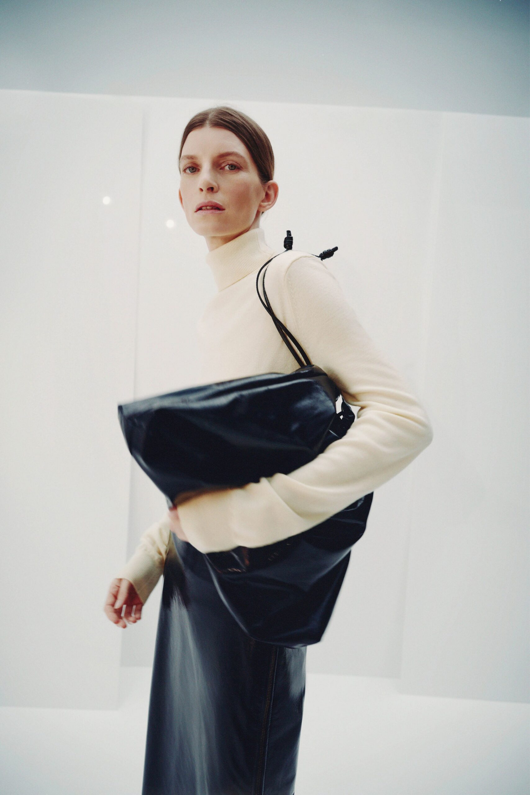 white turtleneck top black leather skirt