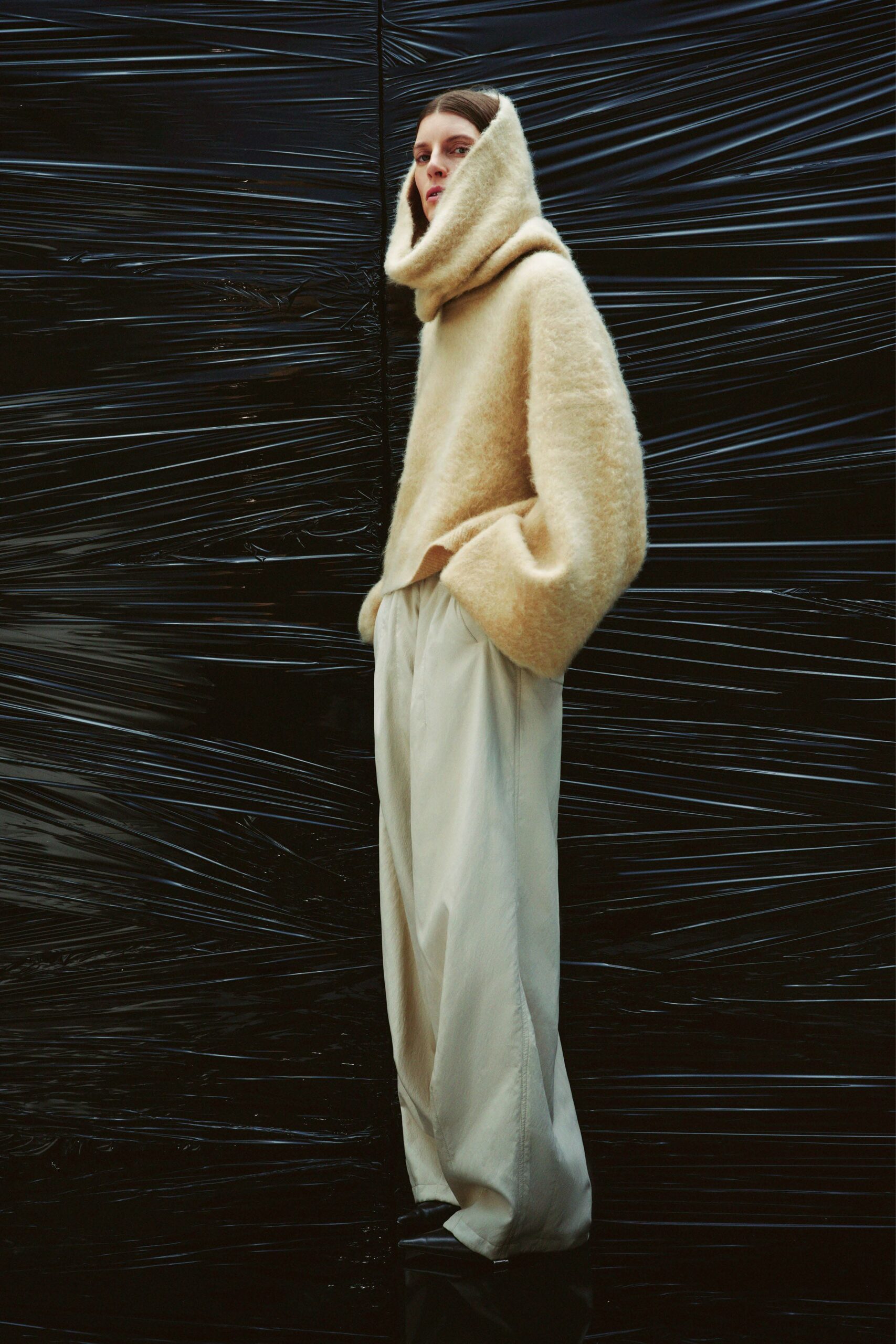 beige hooded sweater with white pants