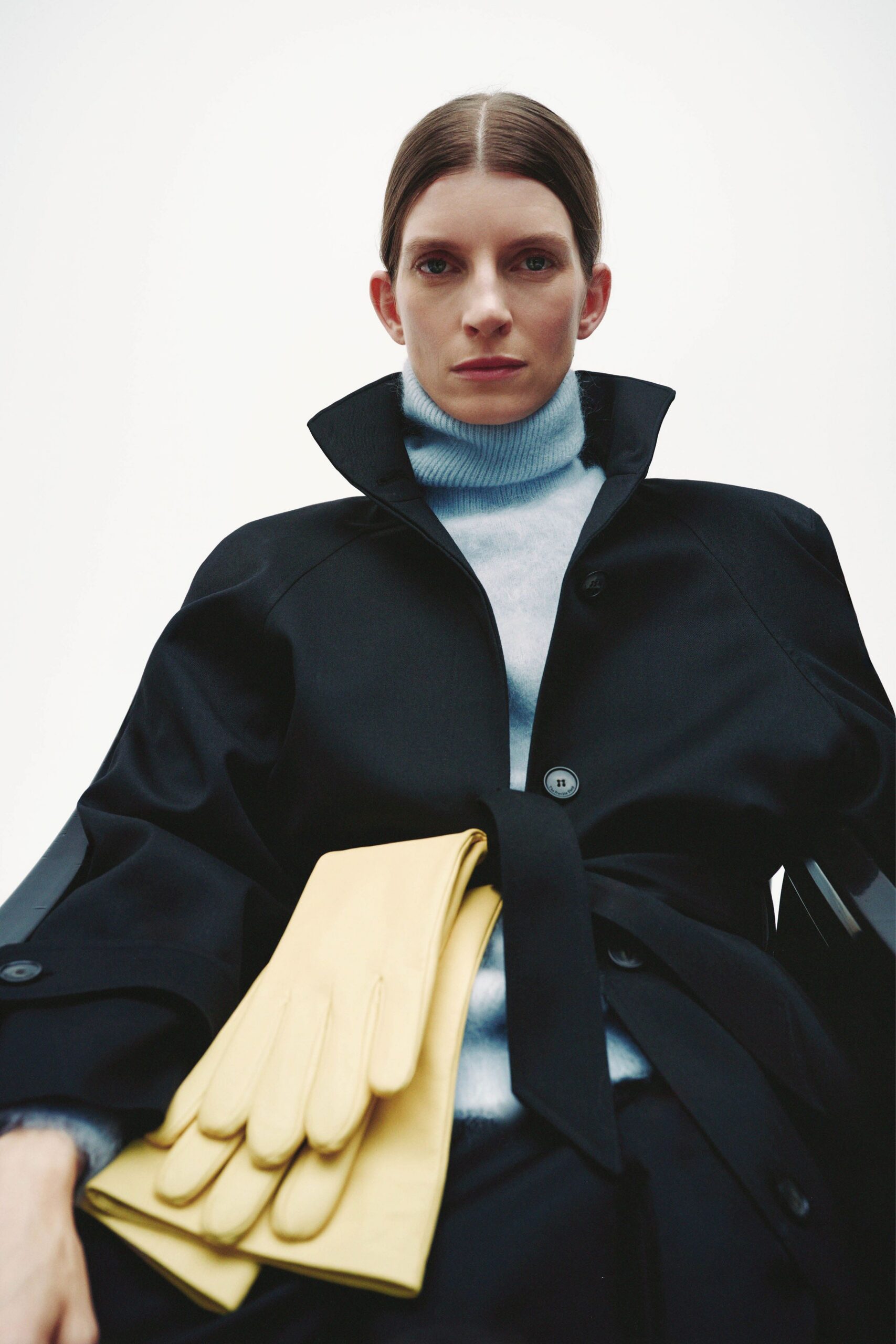 black coat light blue turtleneck