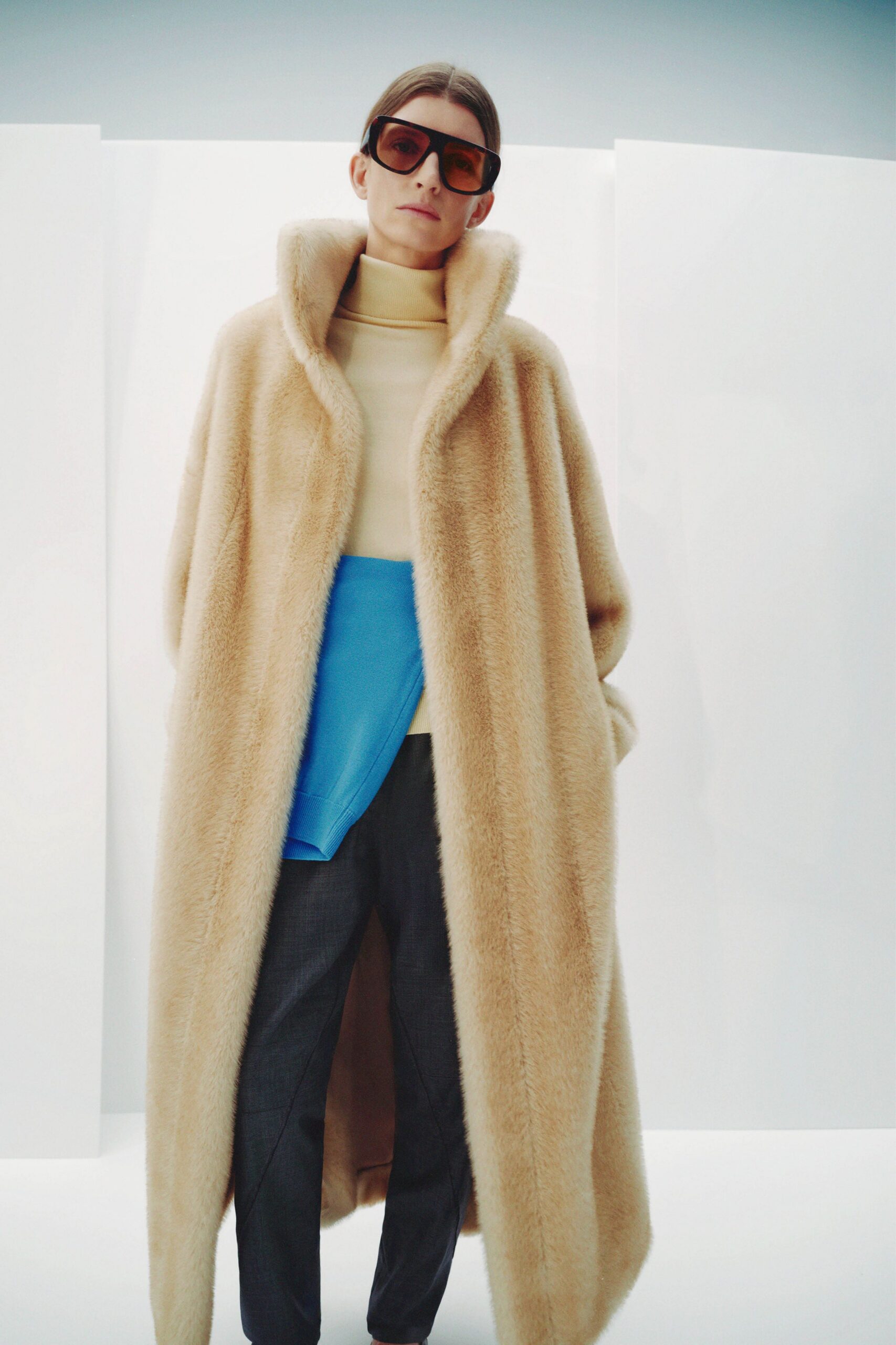 beige faux-fur coat with ivory top