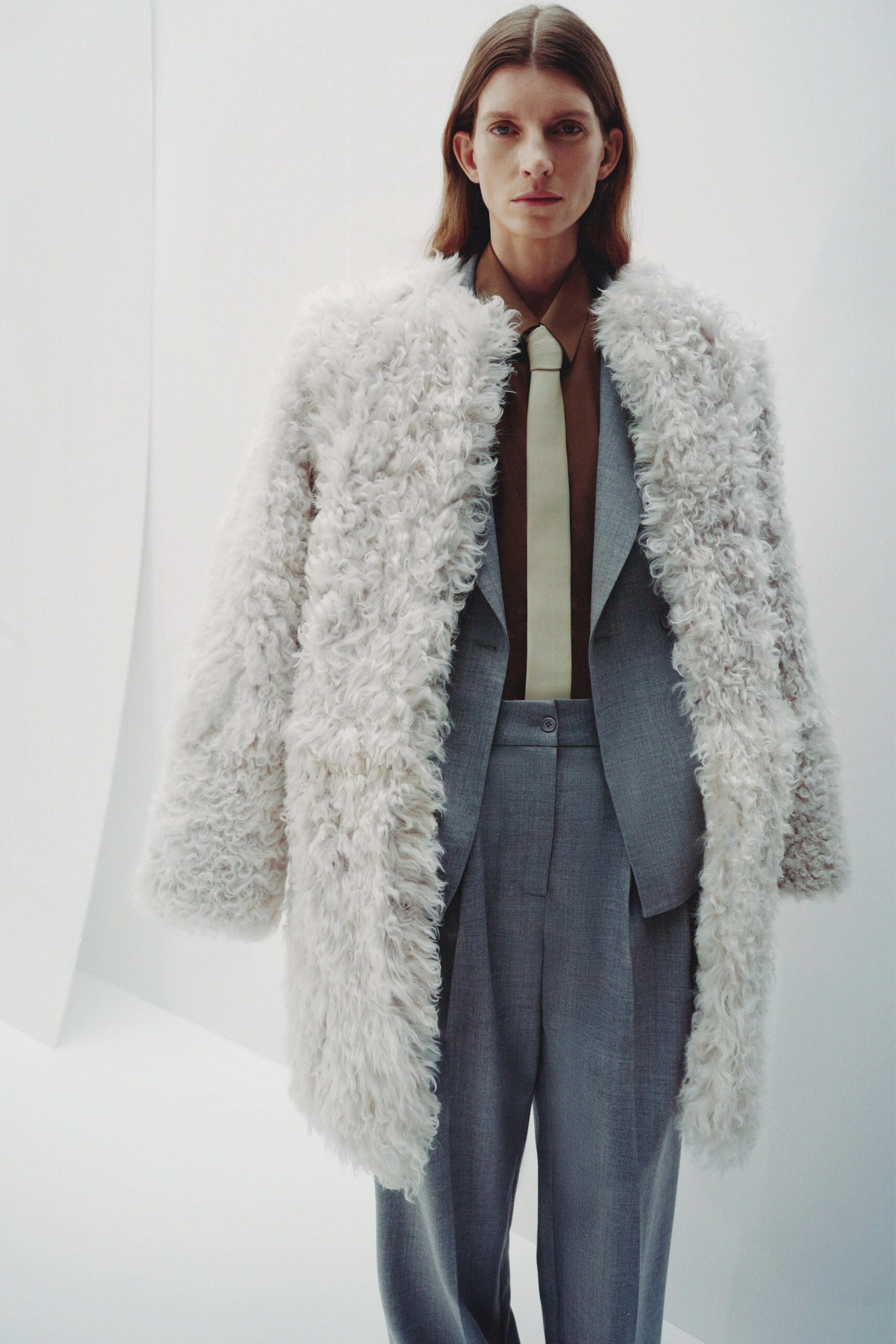 white faux-fur coat gray blazer