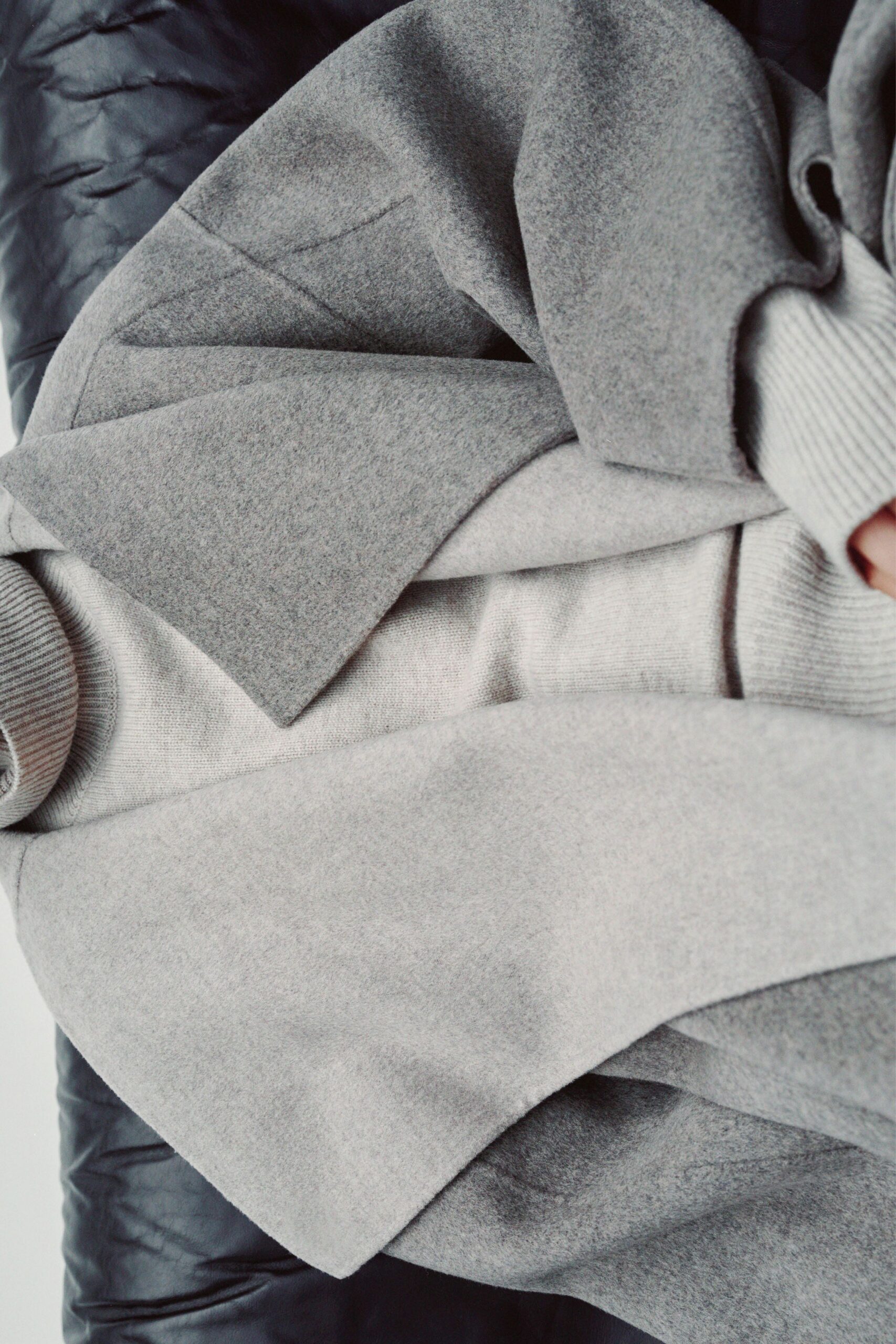gray wool coat and beige sweater
