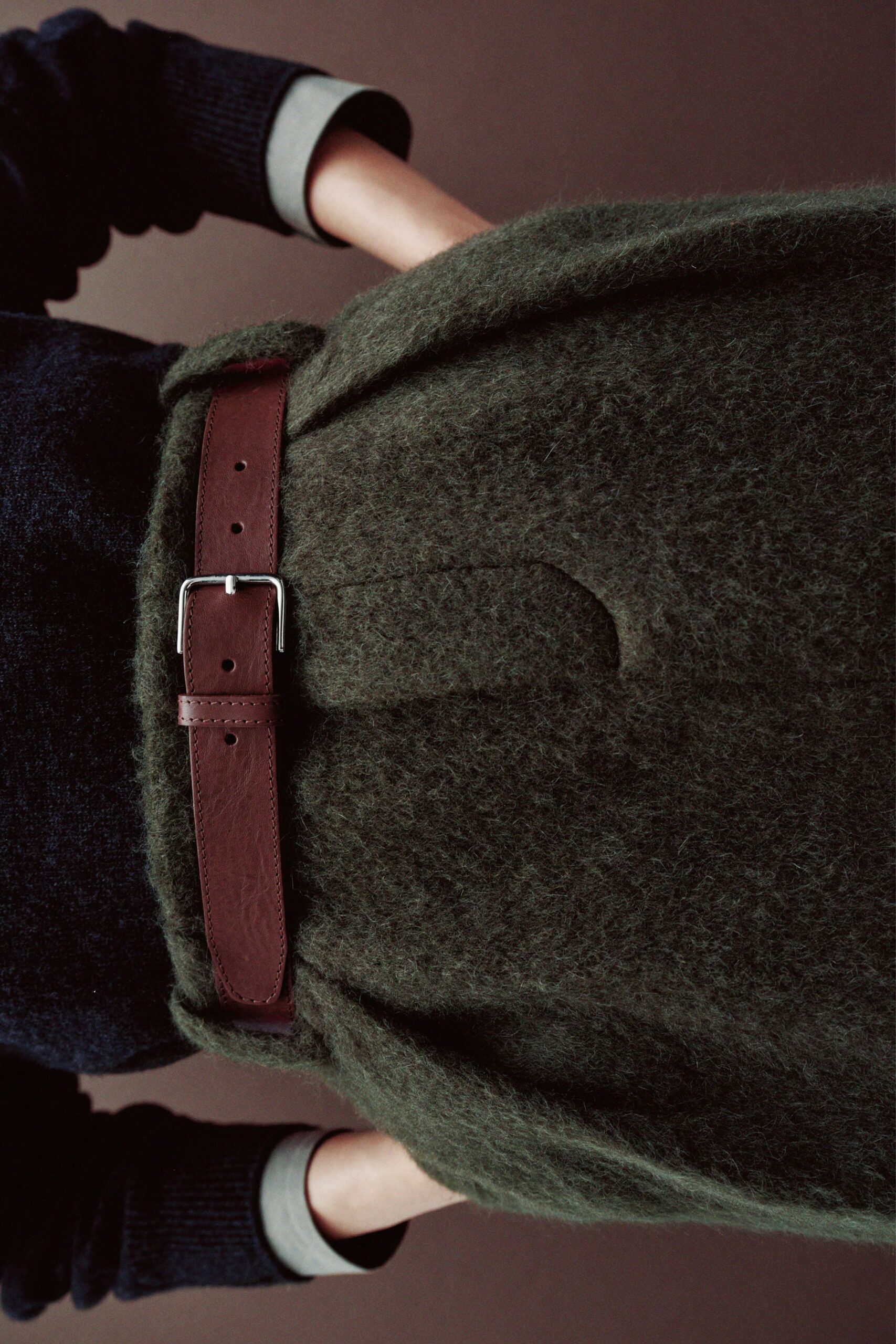 relaxed green wool sweater with belt