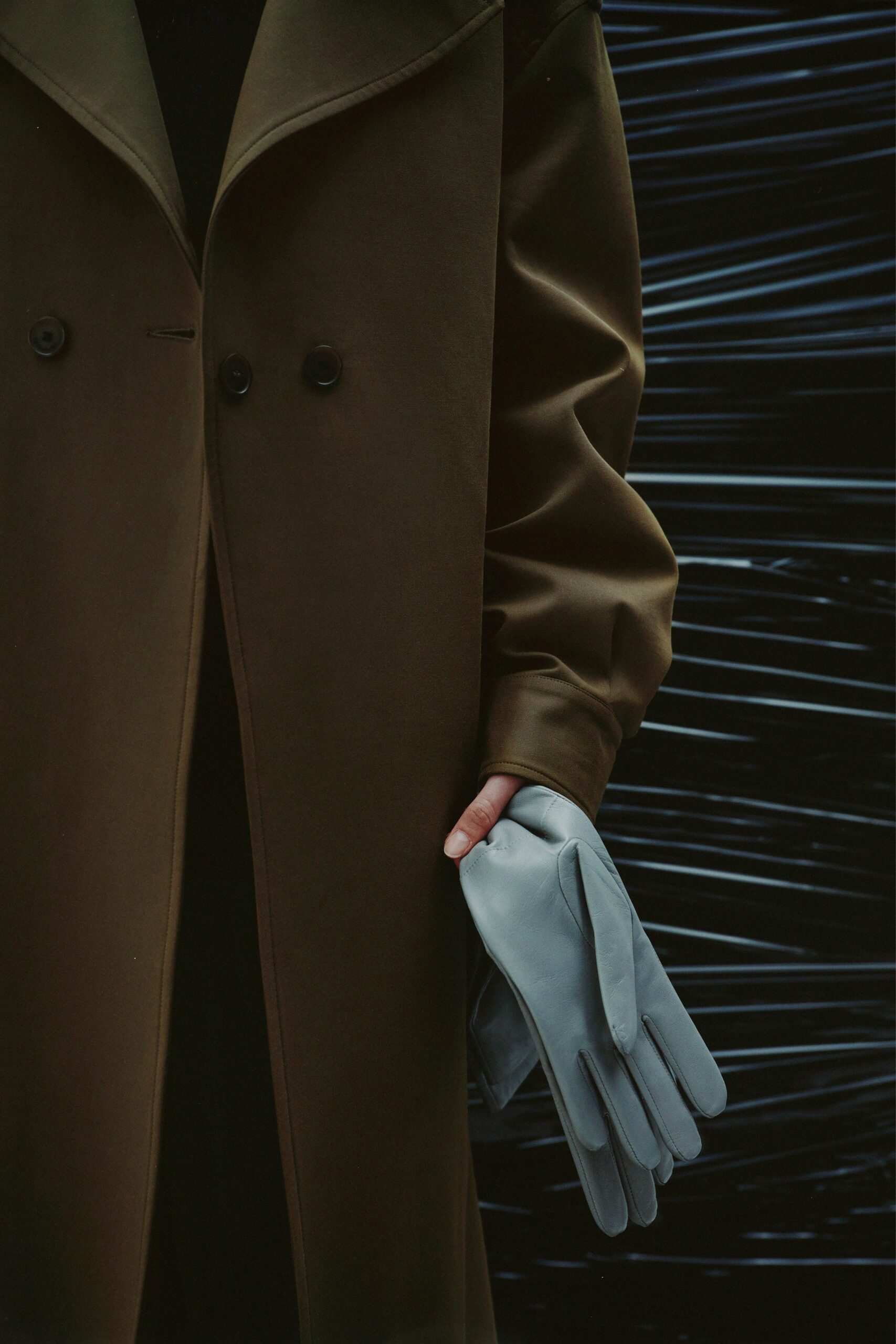 brown wool coat with gray gloves