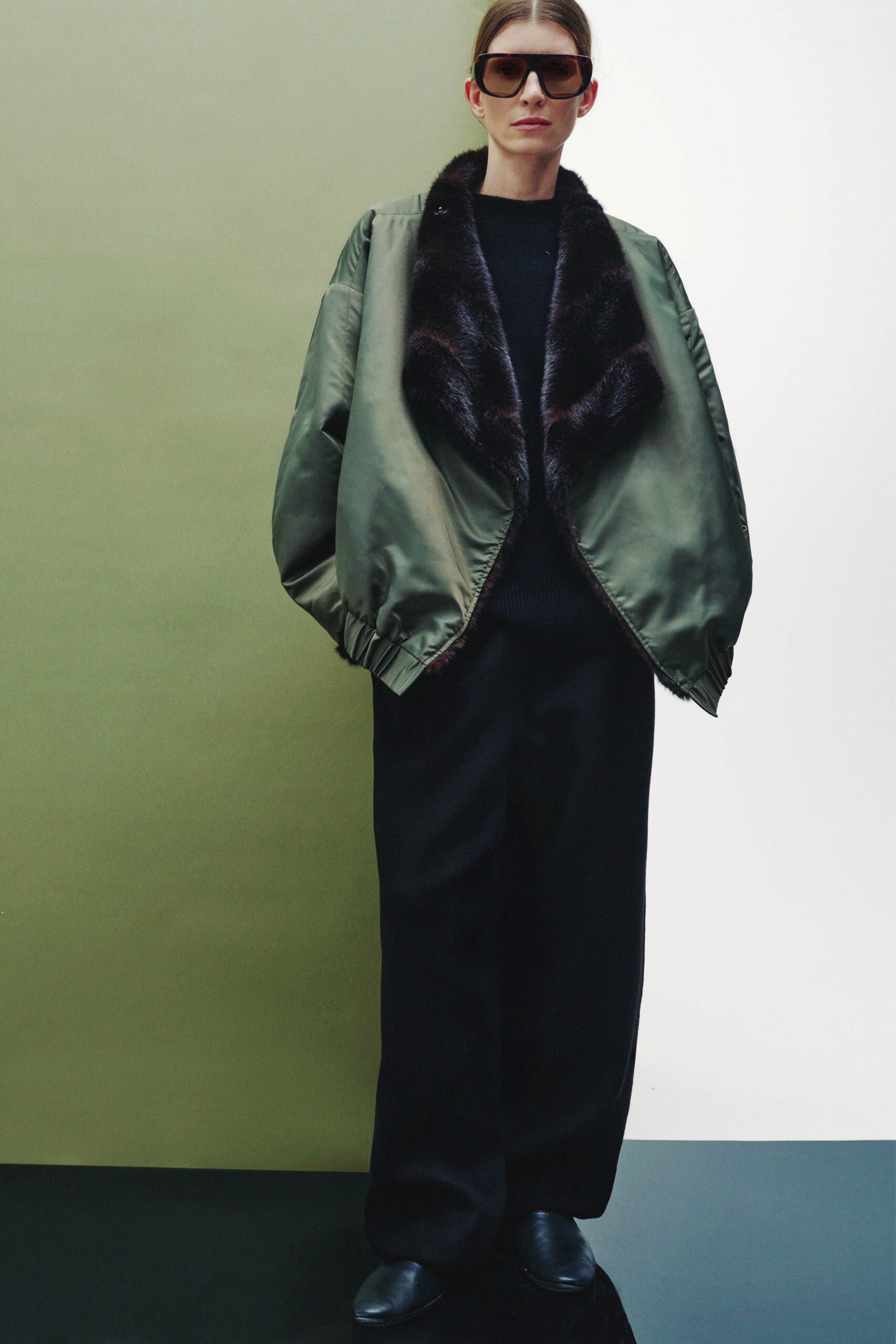 green silk jacket black sweater