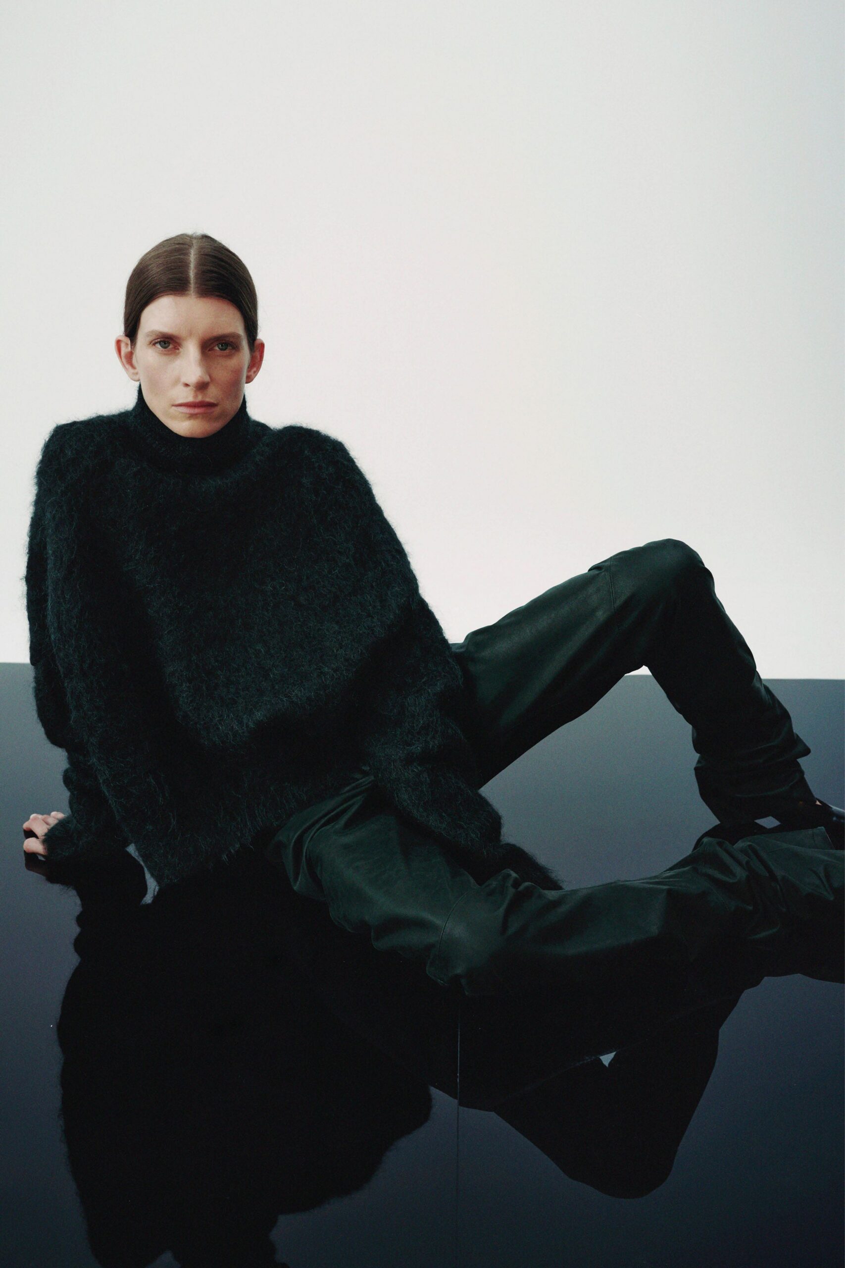 black oversized sweater and fitted pants