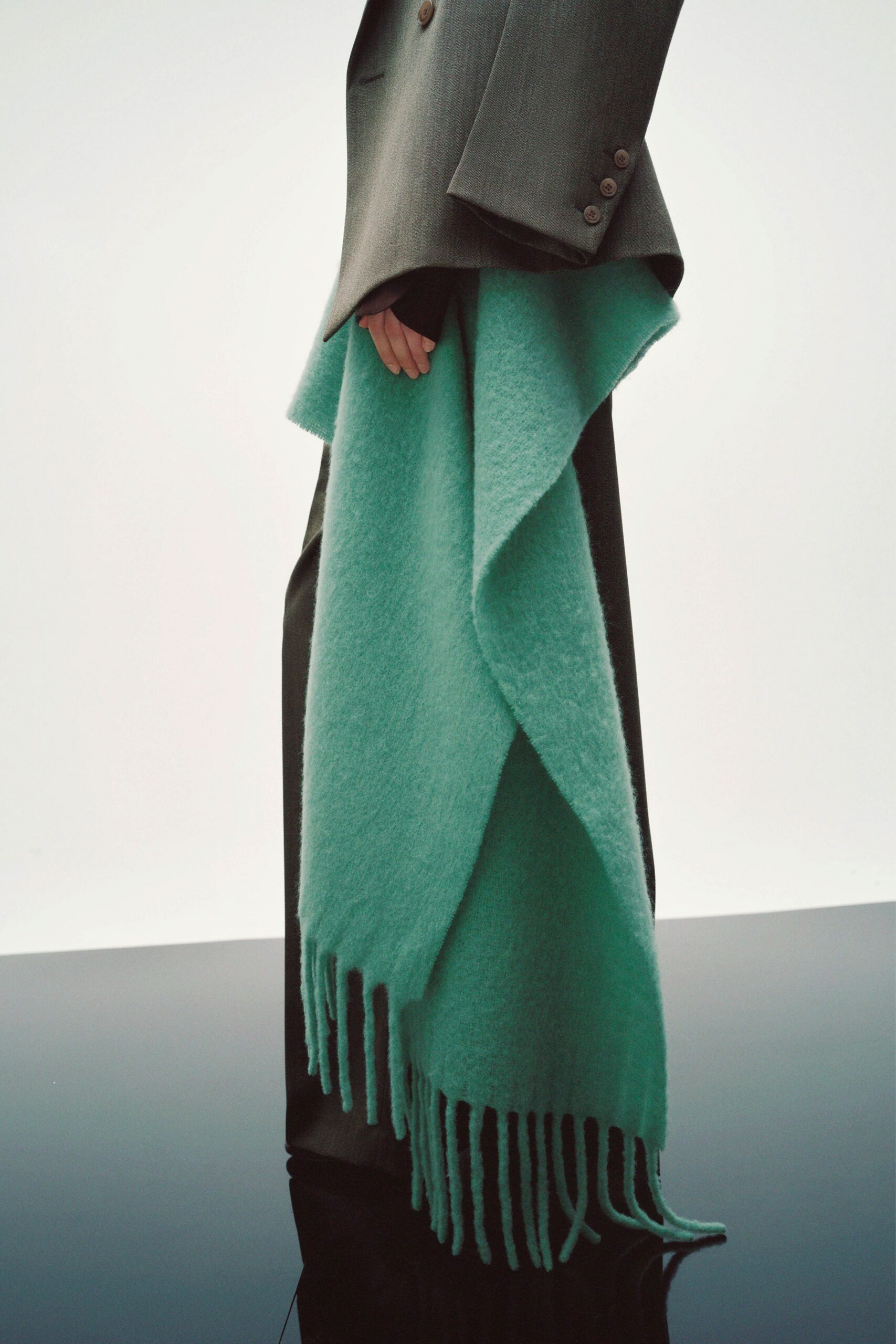 gray tailored blazer with teal scarf