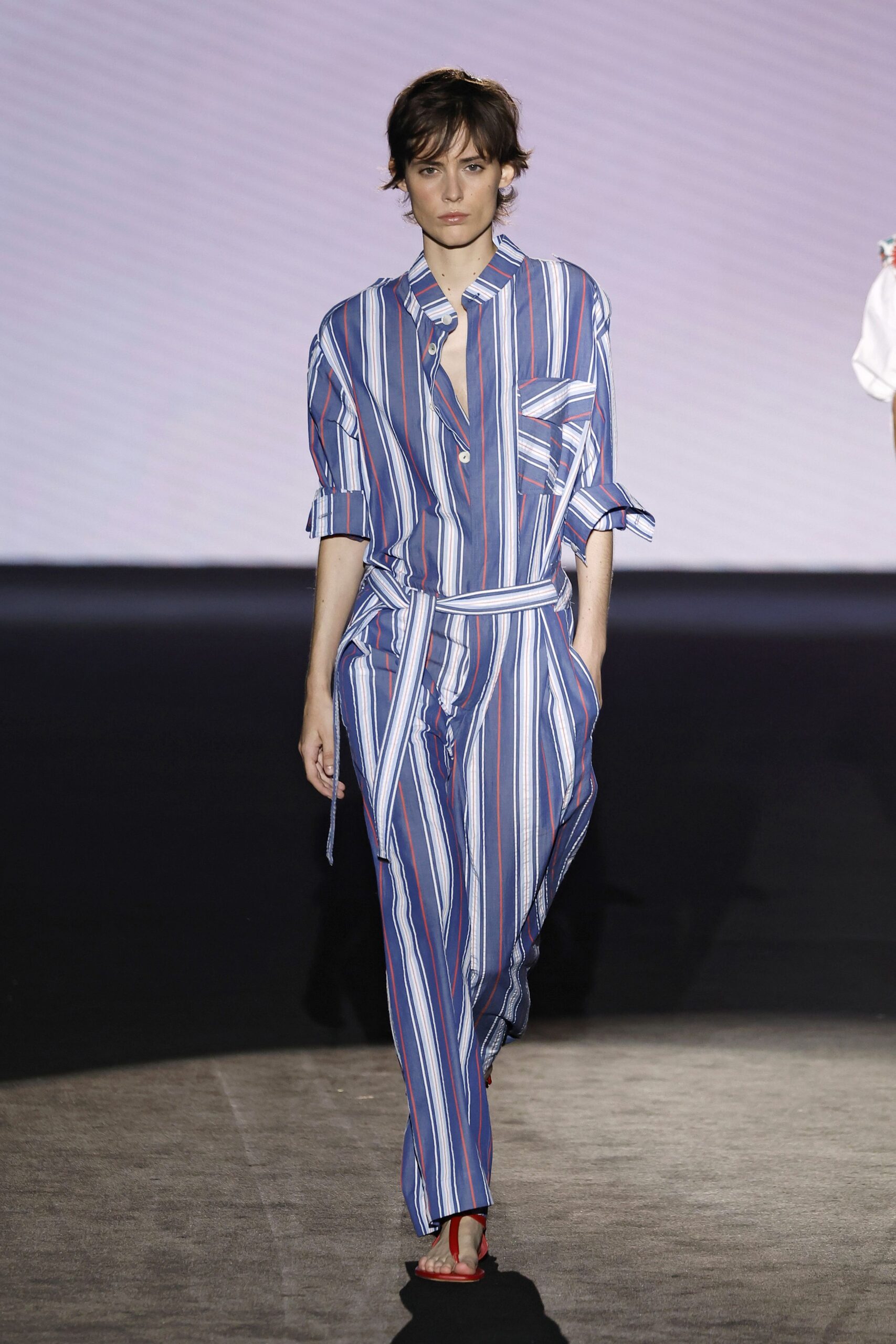 striped relaxed jumpsuit with red shoes