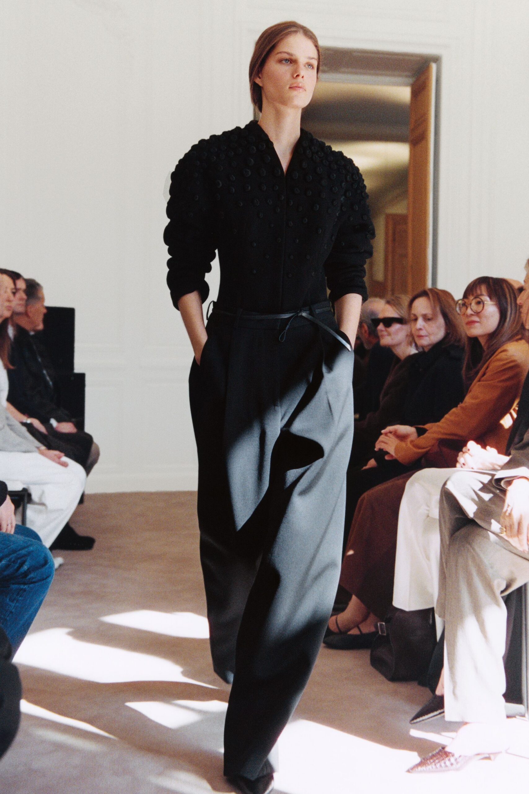 black fitted top and relaxed pants