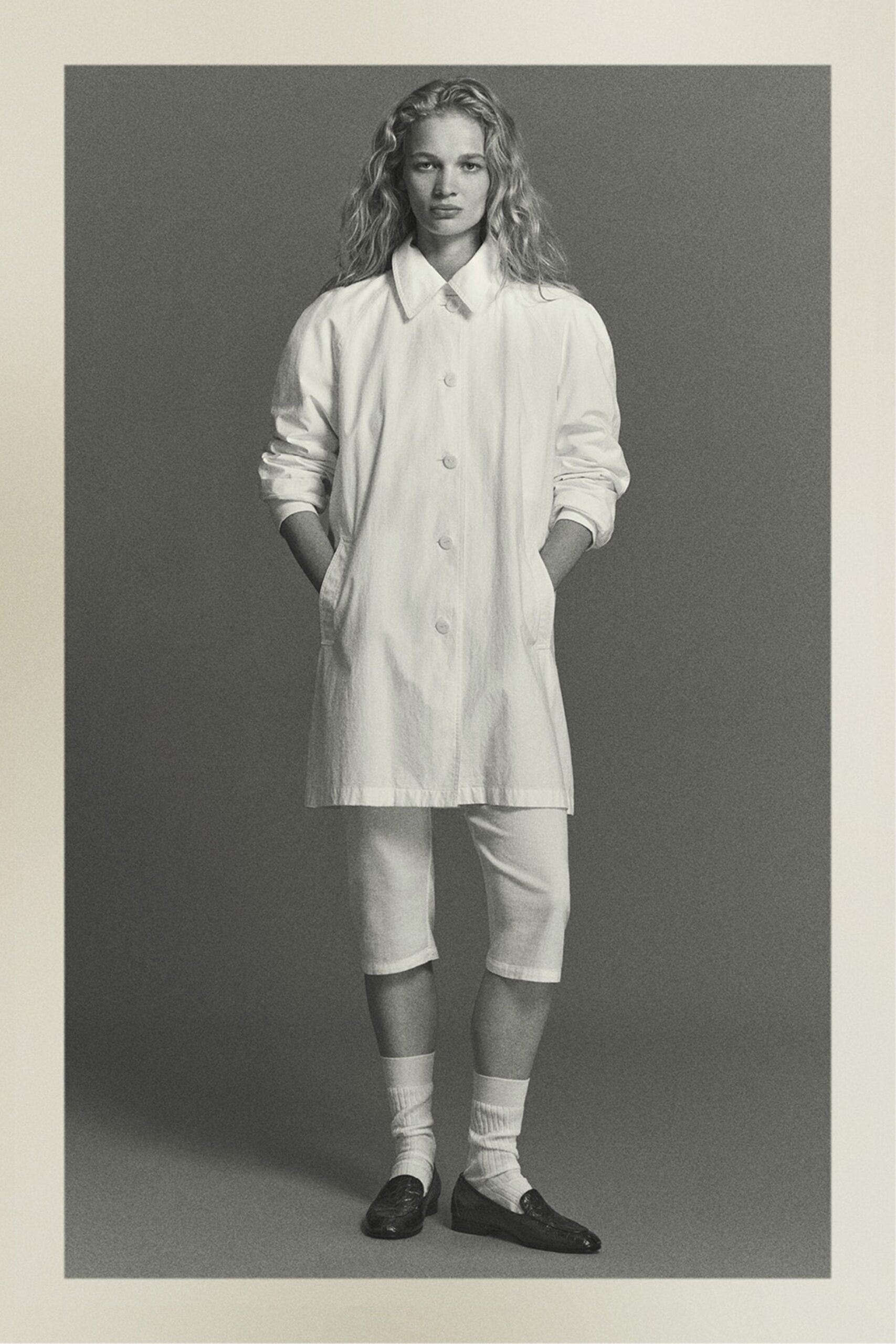 white cotton long-sleeve collared relaxed buttoned coat