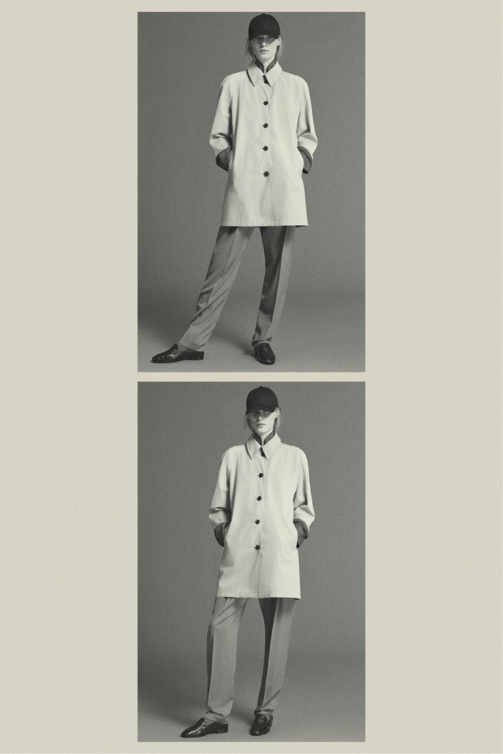 white cotton long-sleeve collared relaxed buttoned coat