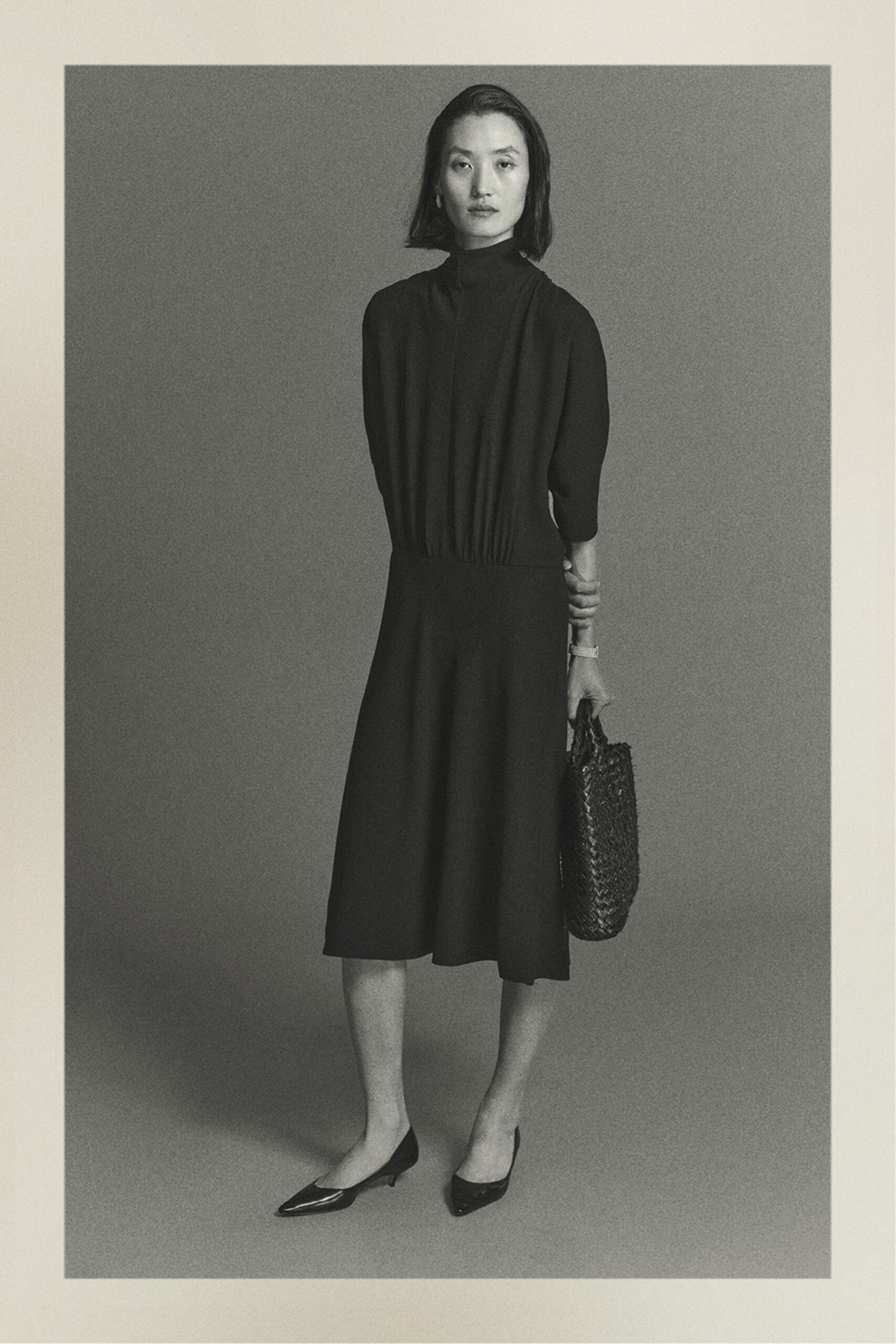 black midi dress with pointed shoes