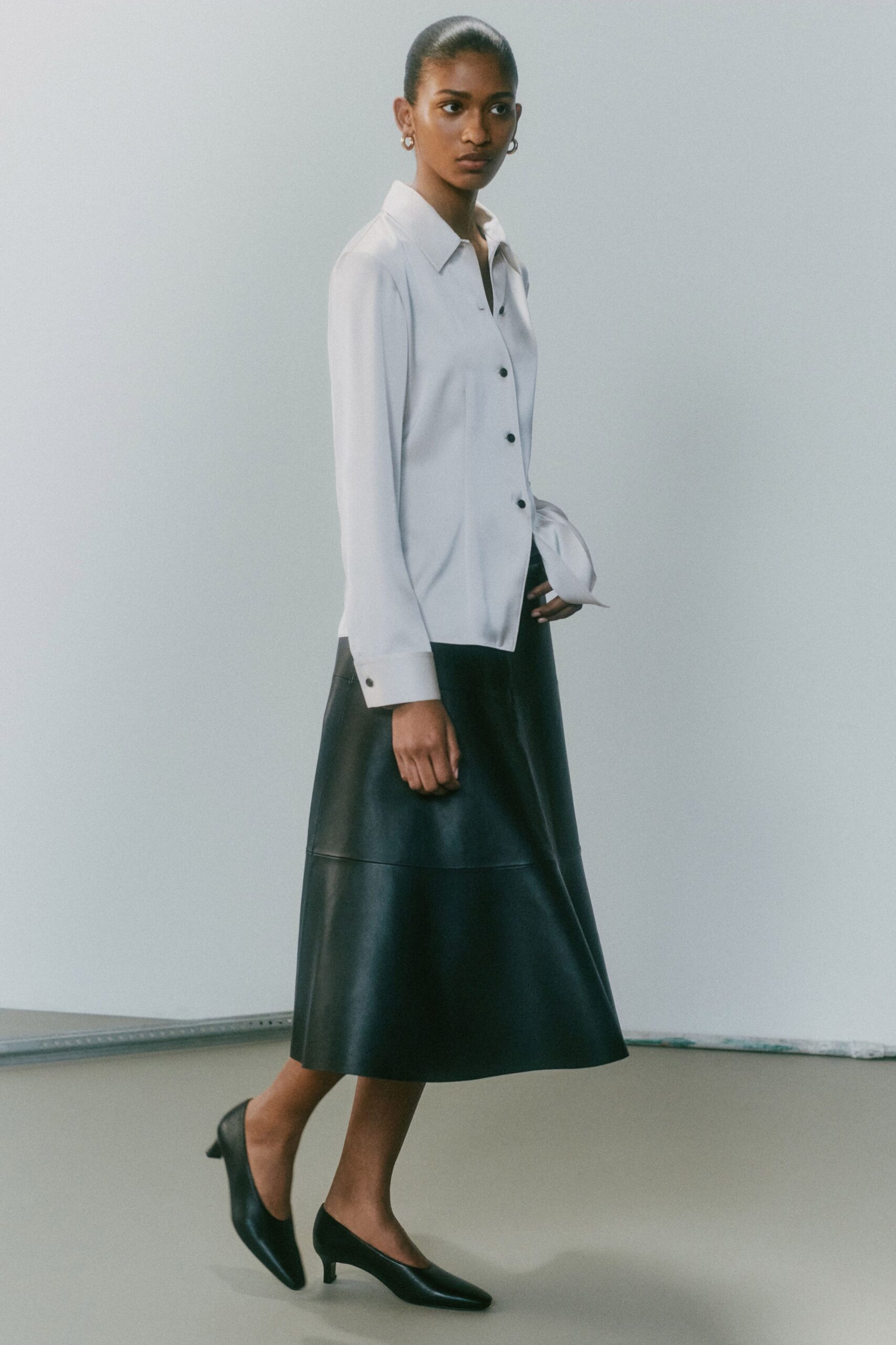black leather fitted a-line midi skirt