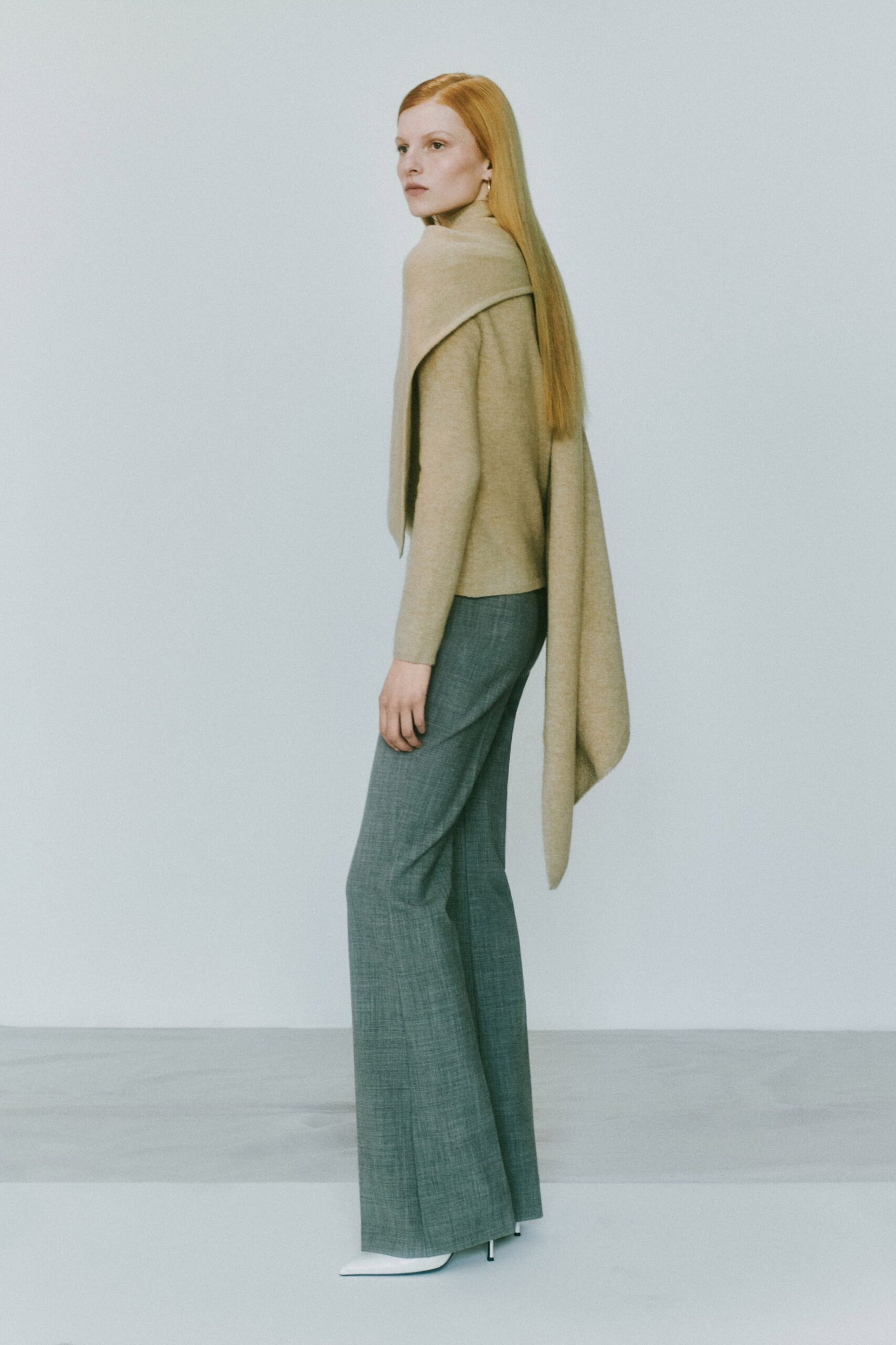 beige wool long-sleeve high-neck fitted draped sweater
