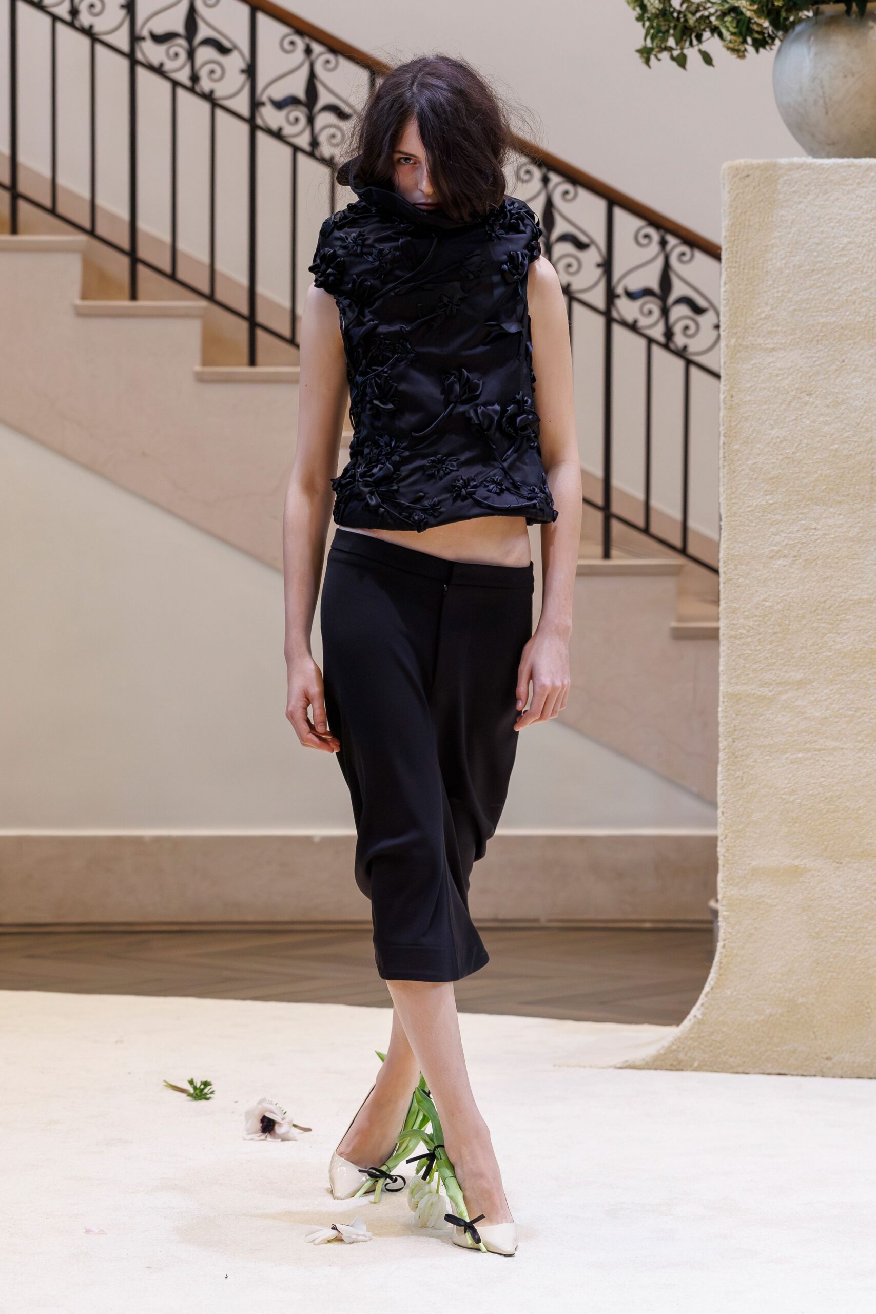 black embroidered sleeveless top with relaxed pants