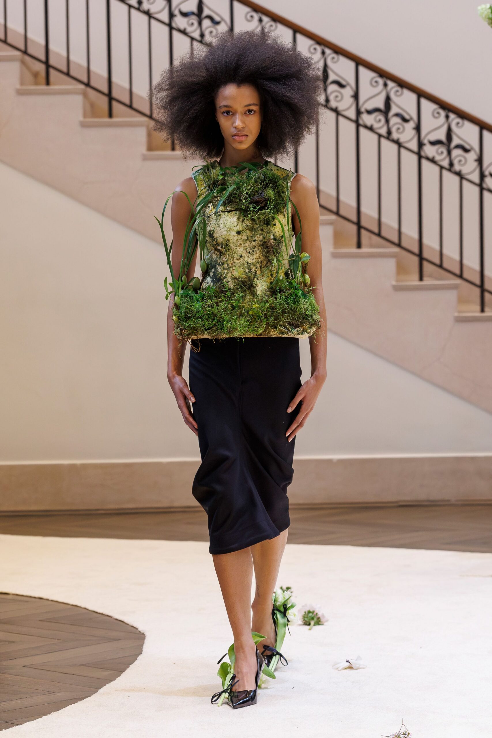 green layered top black midi skirt