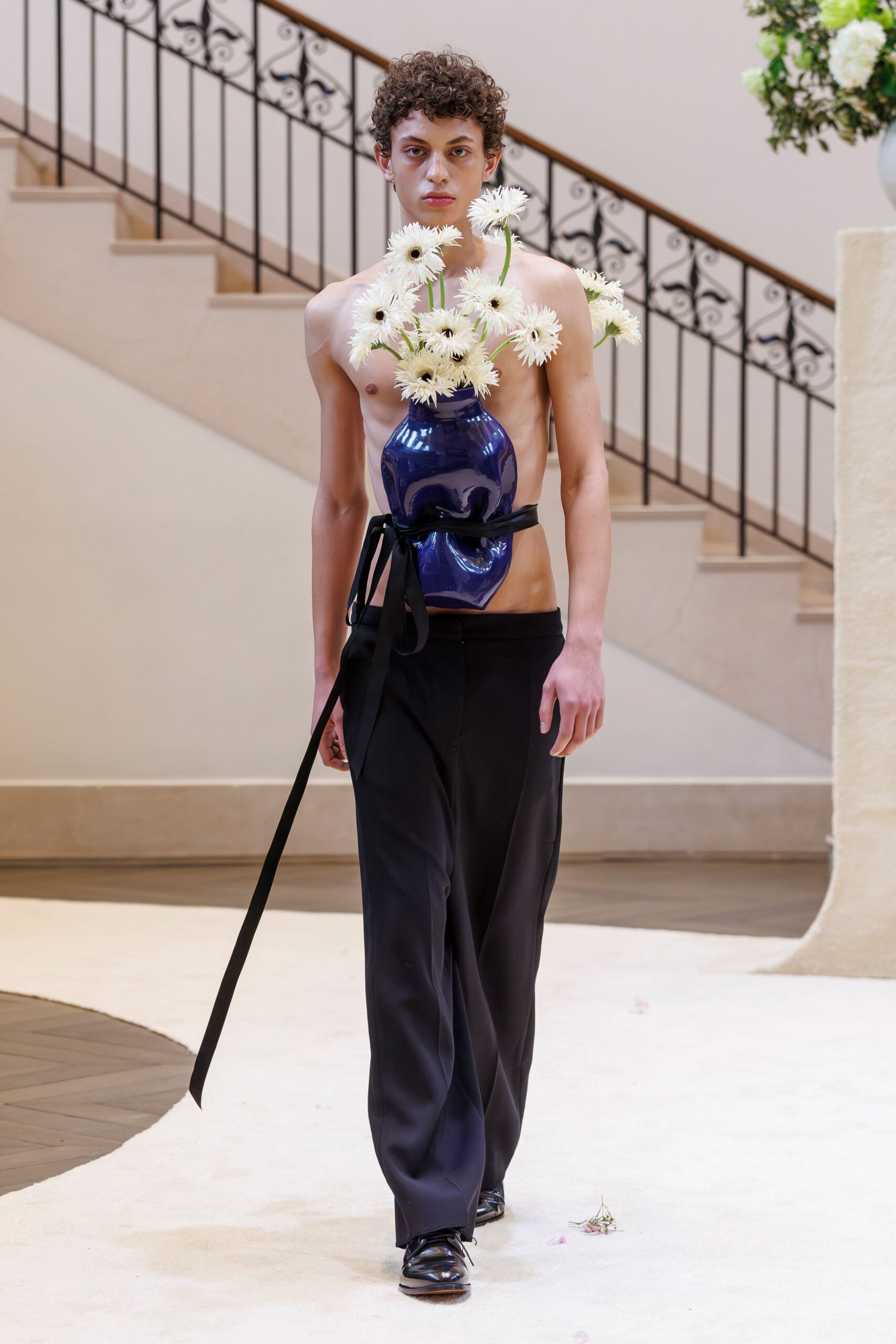 black fitted pants and nude sleeveless top