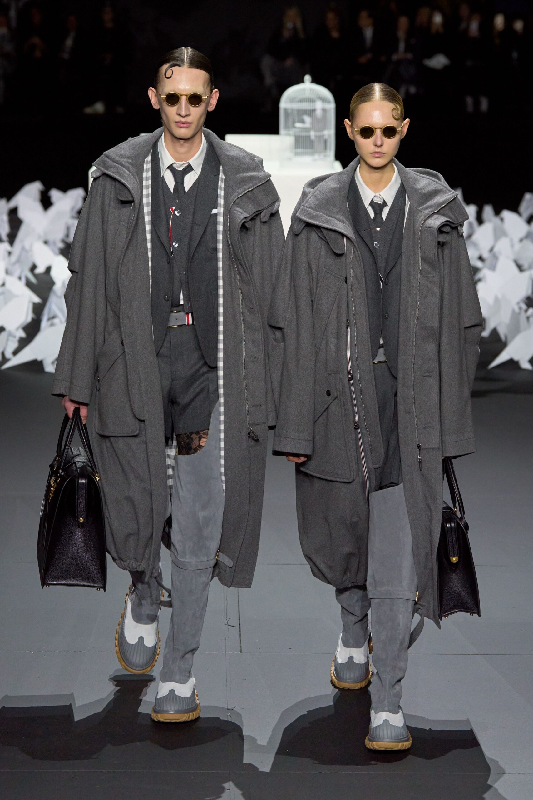 gray coat and black suit