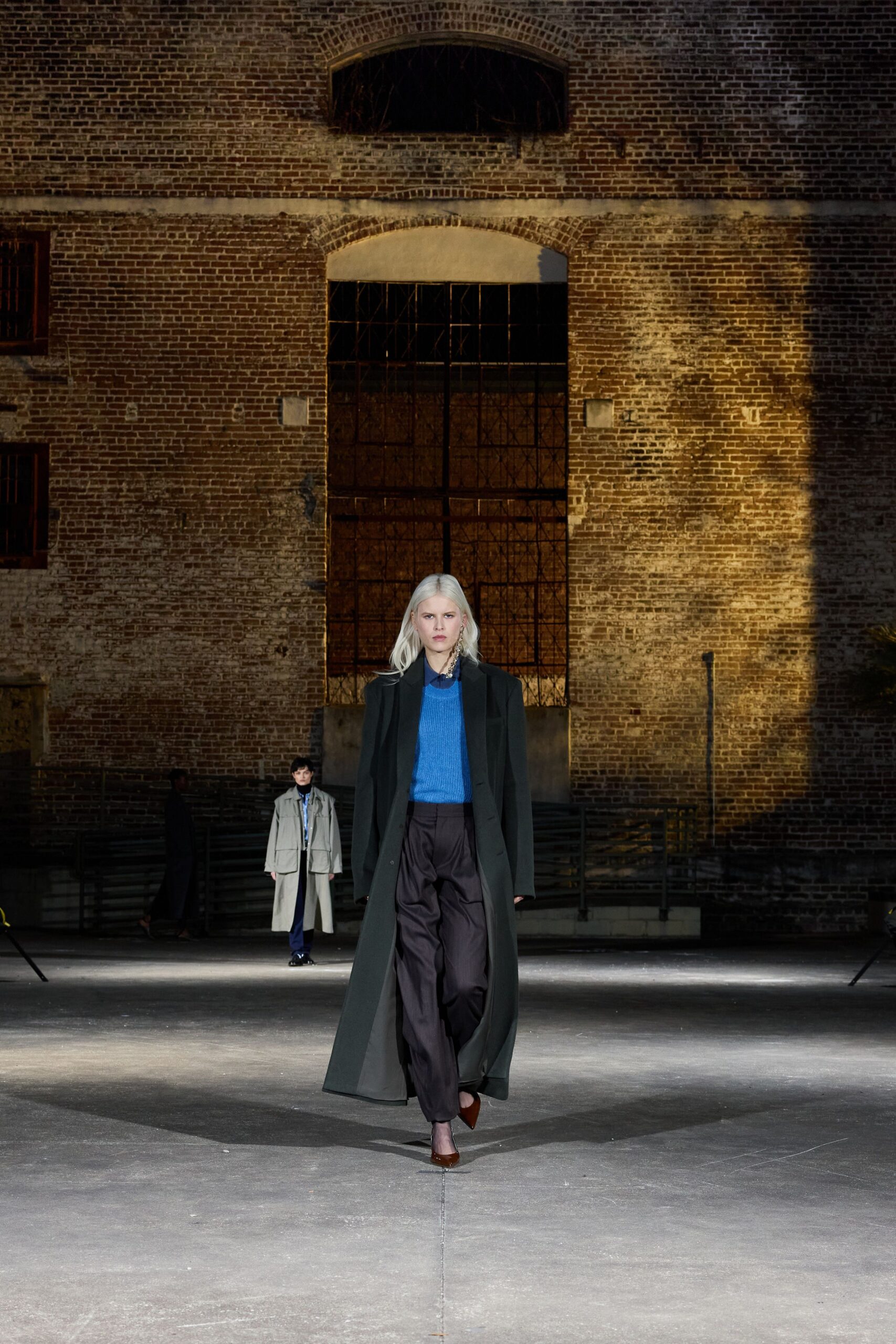 black coat blue top relaxed pants