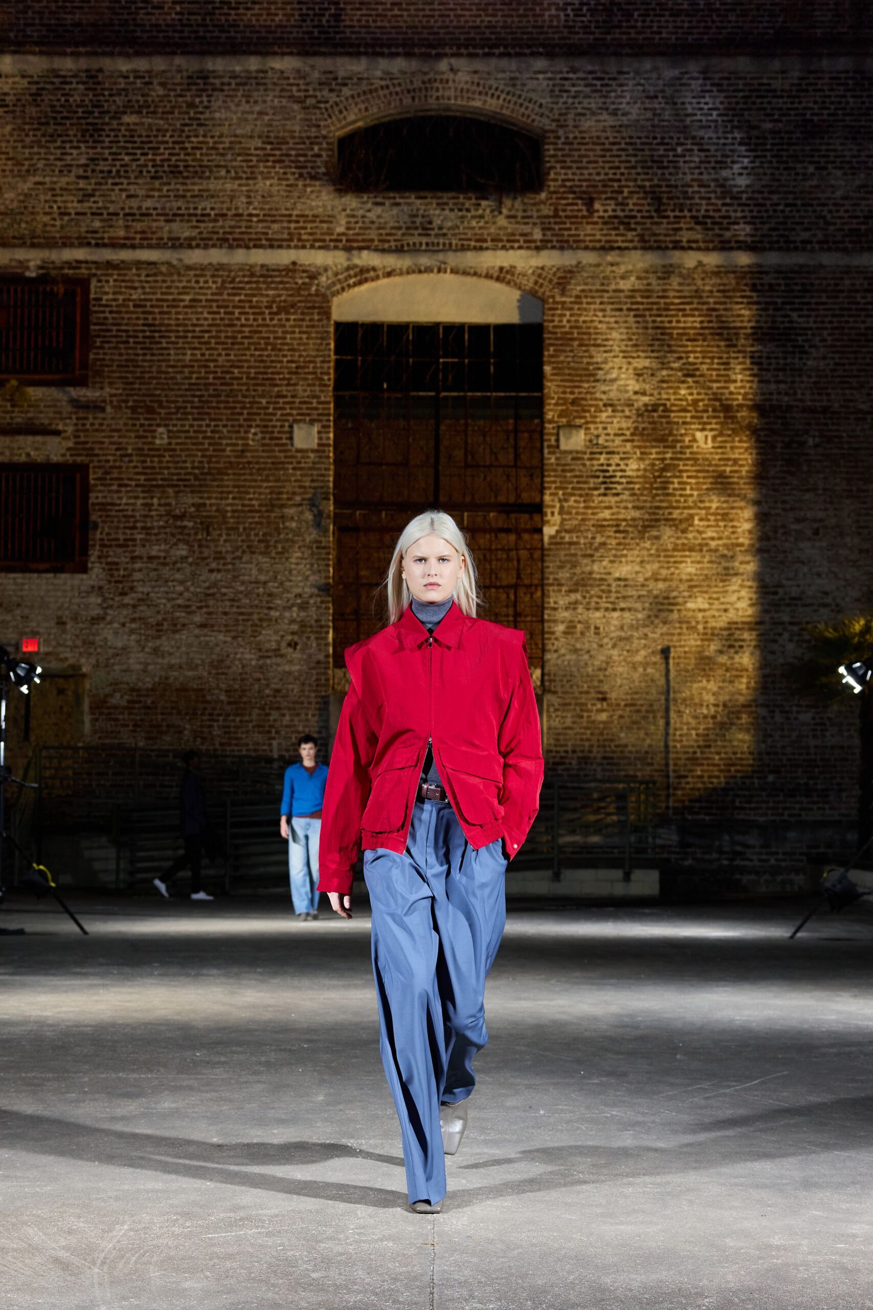 red fitted jacket blue relaxed pants