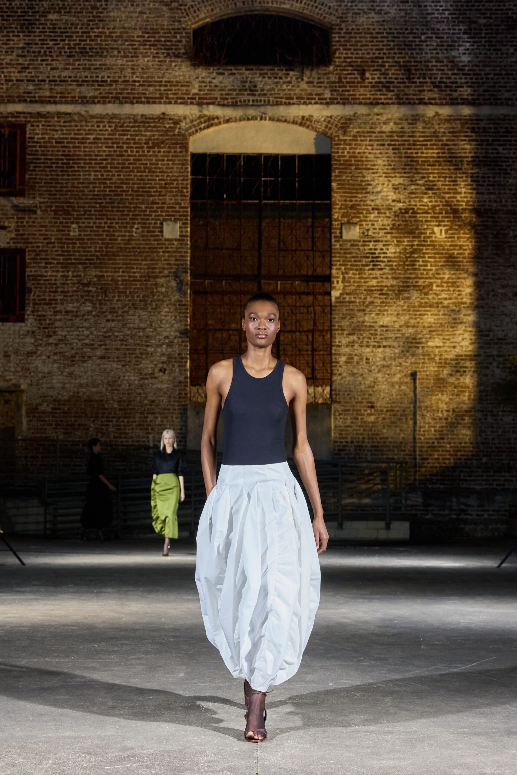 black fitted top white pleated skirt