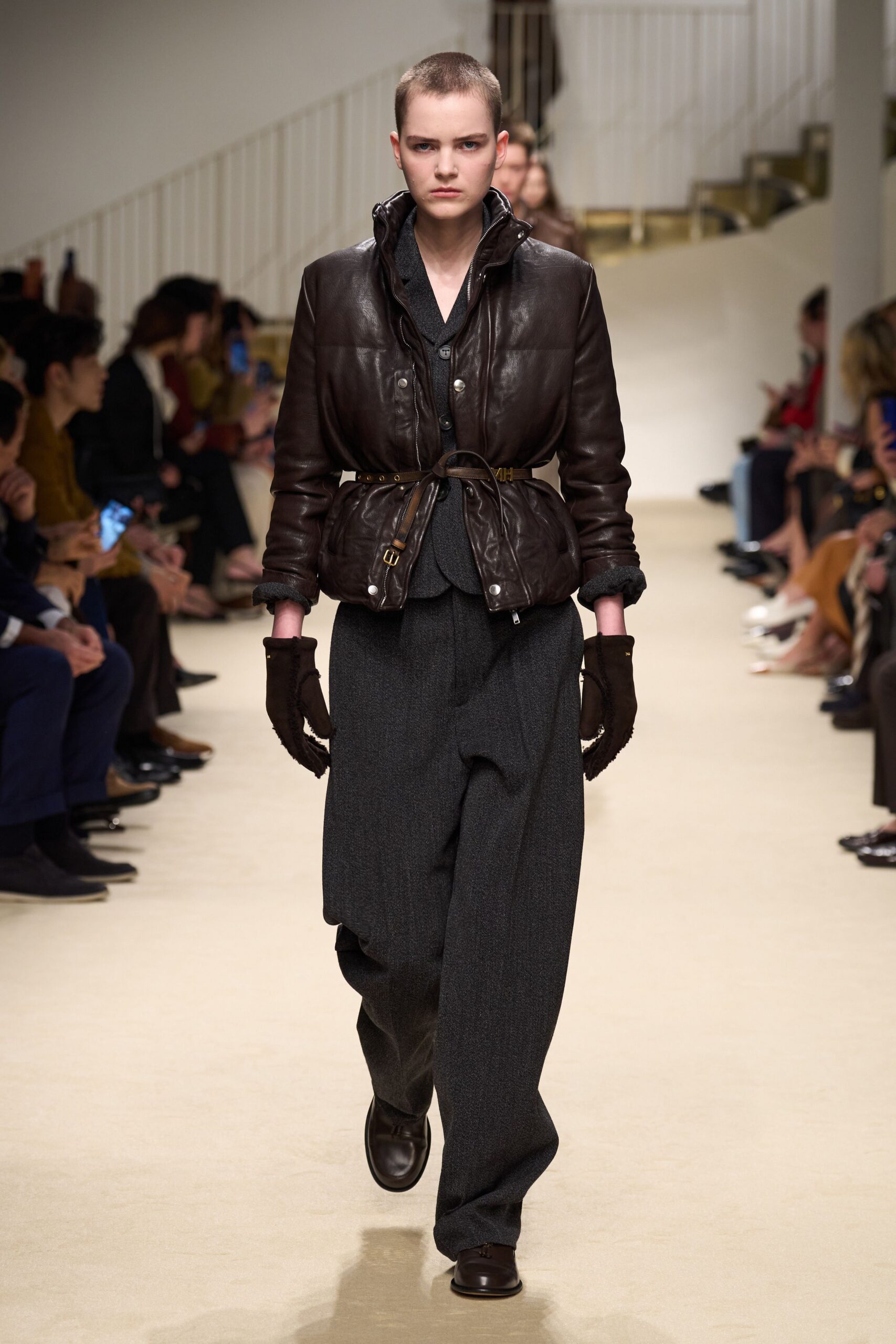 brown leather jacket with gray pants