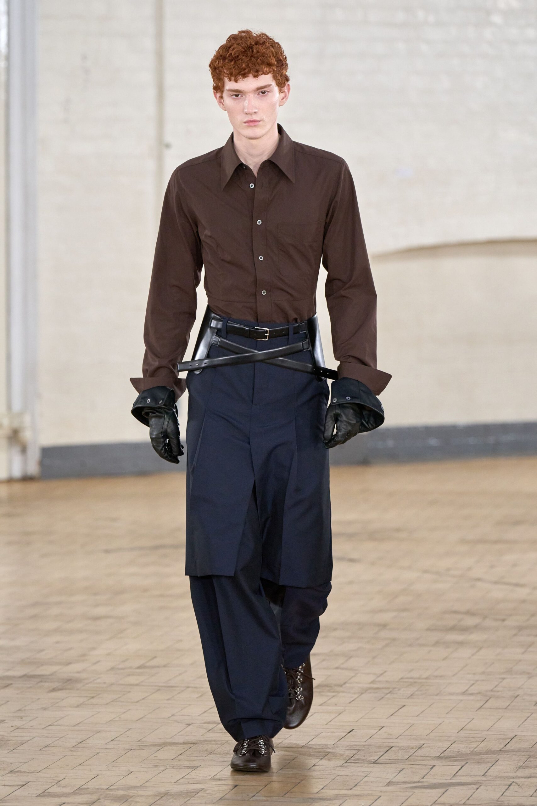 brown fitted shirt and navy pants