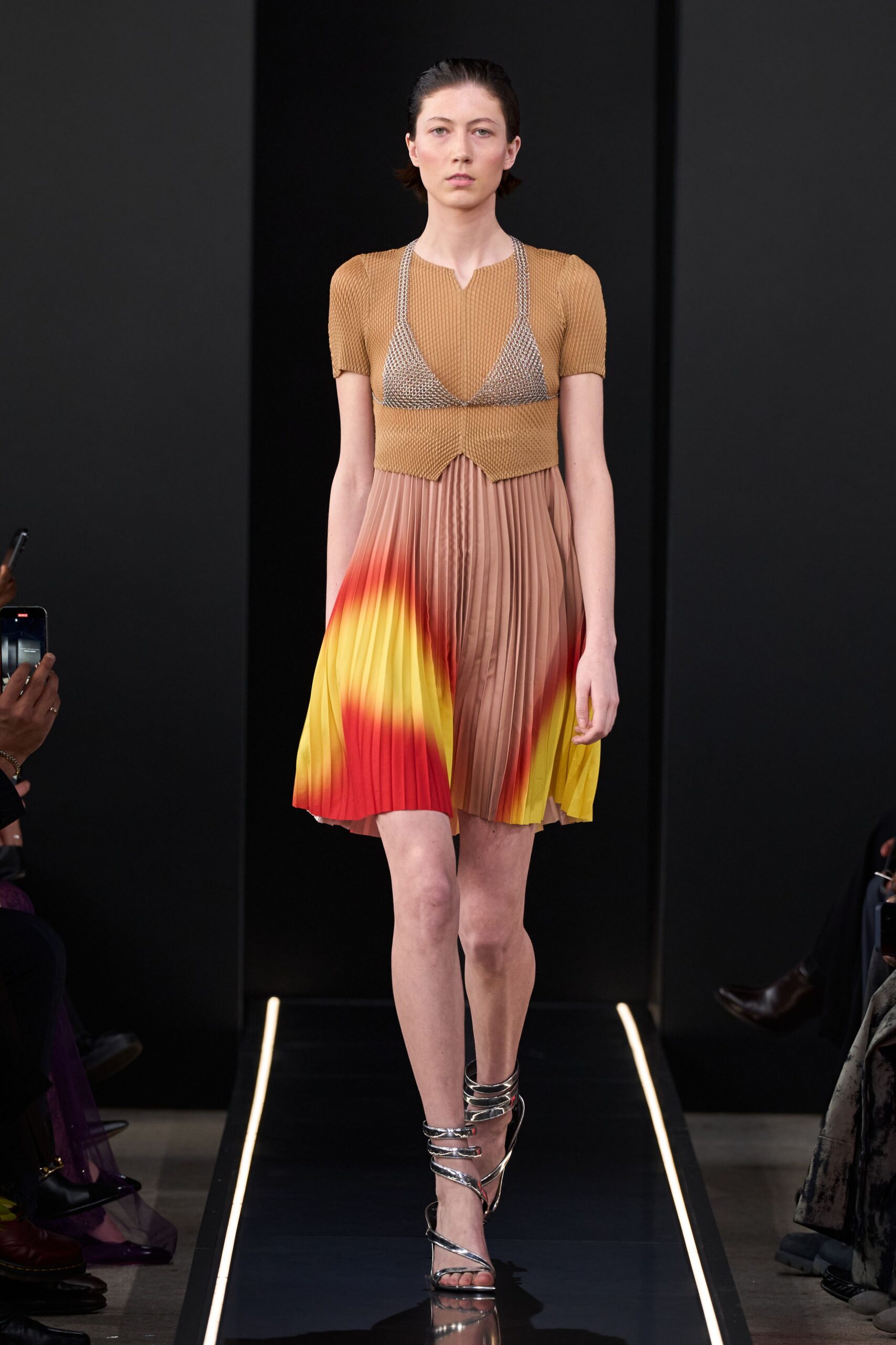 brown and yellow pleated dress with strappy shoes