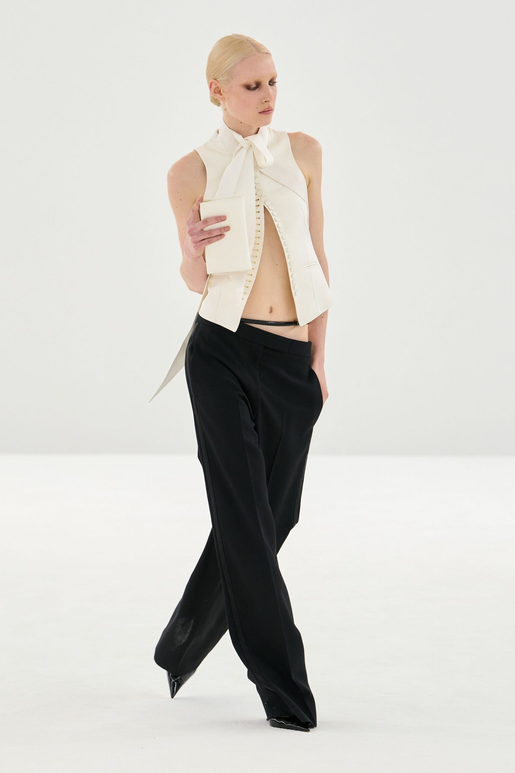 white silk sleeveless high-neck fitted buttoned top