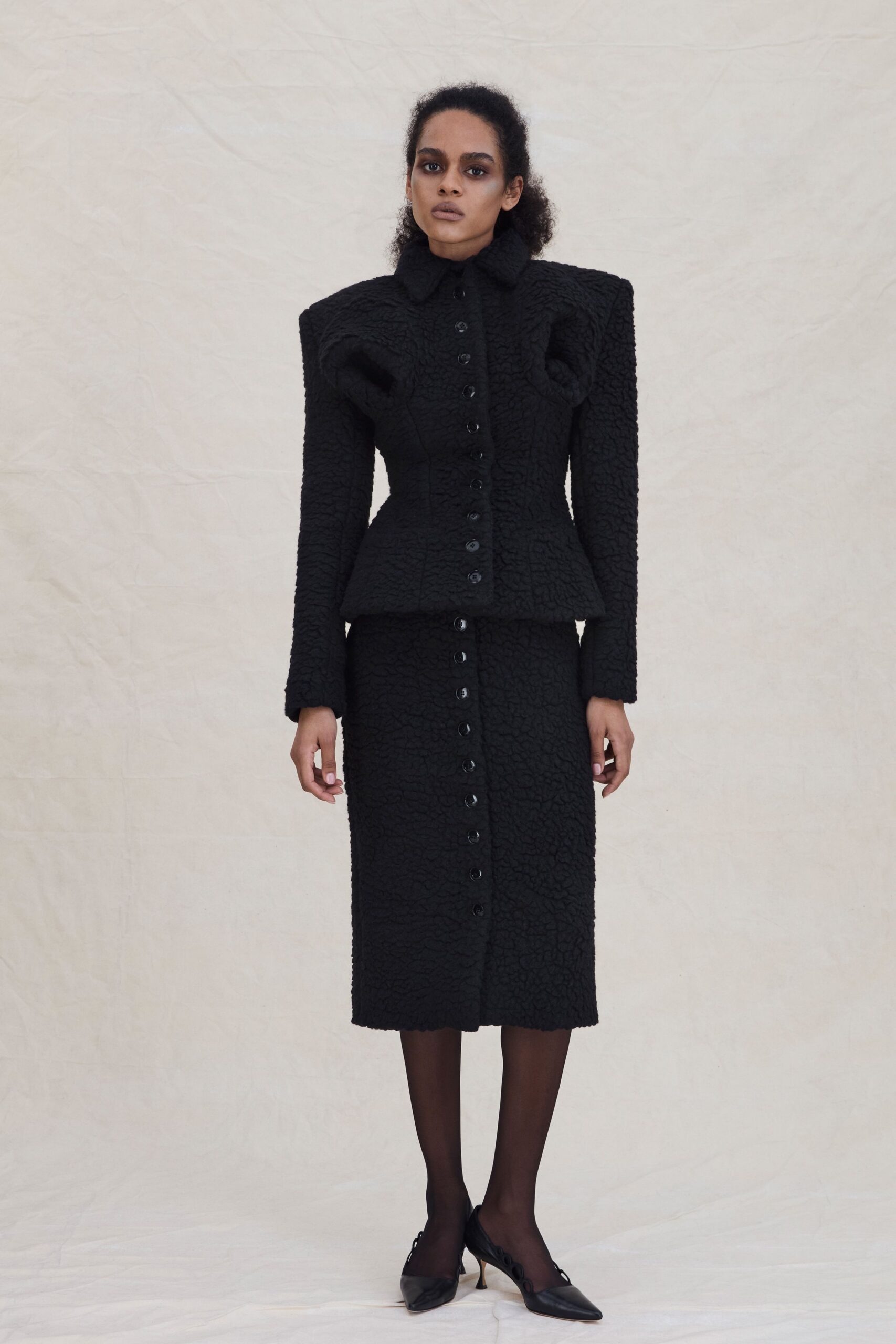 black structured blazer and skirt