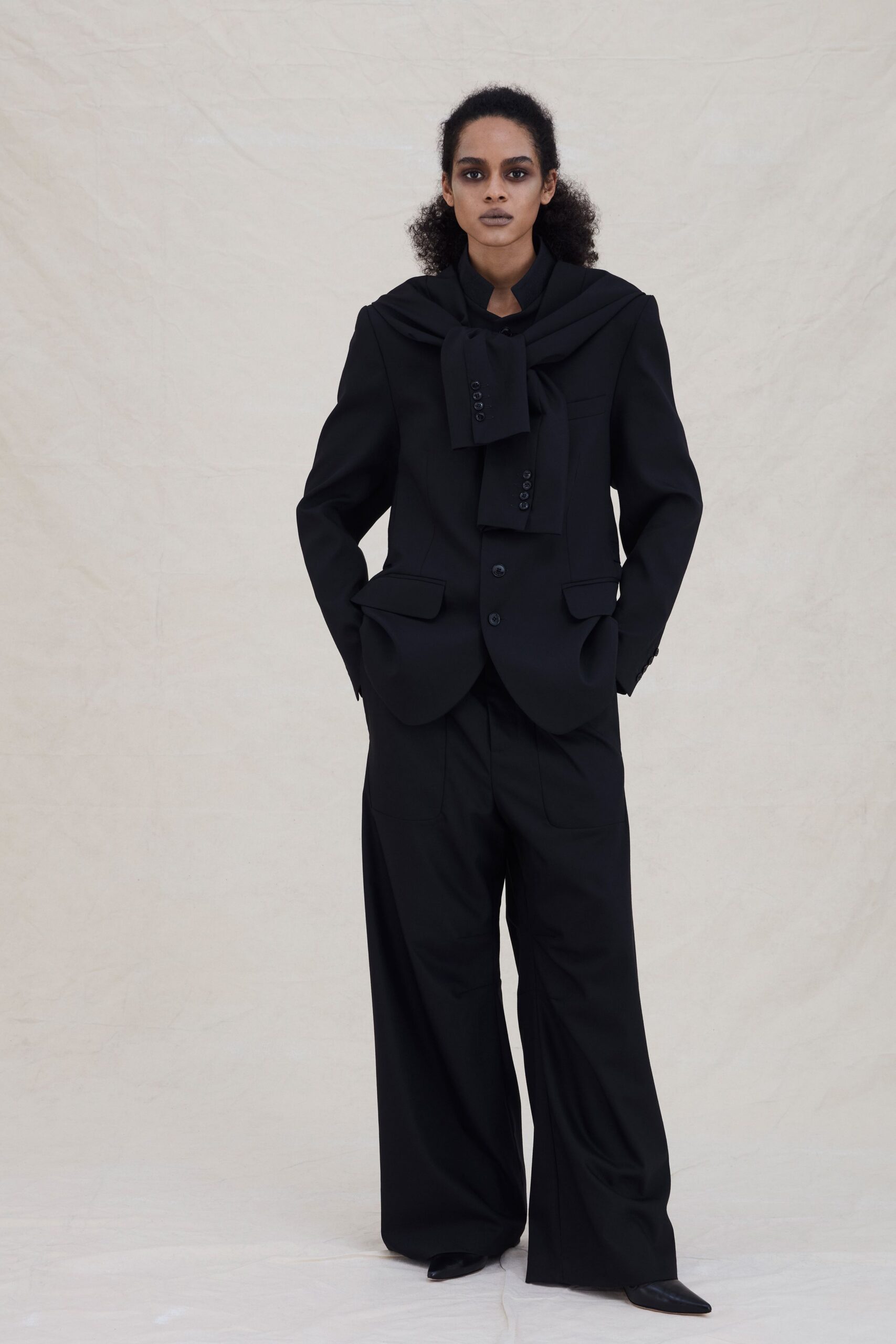 black tailored suit with wide-leg pants