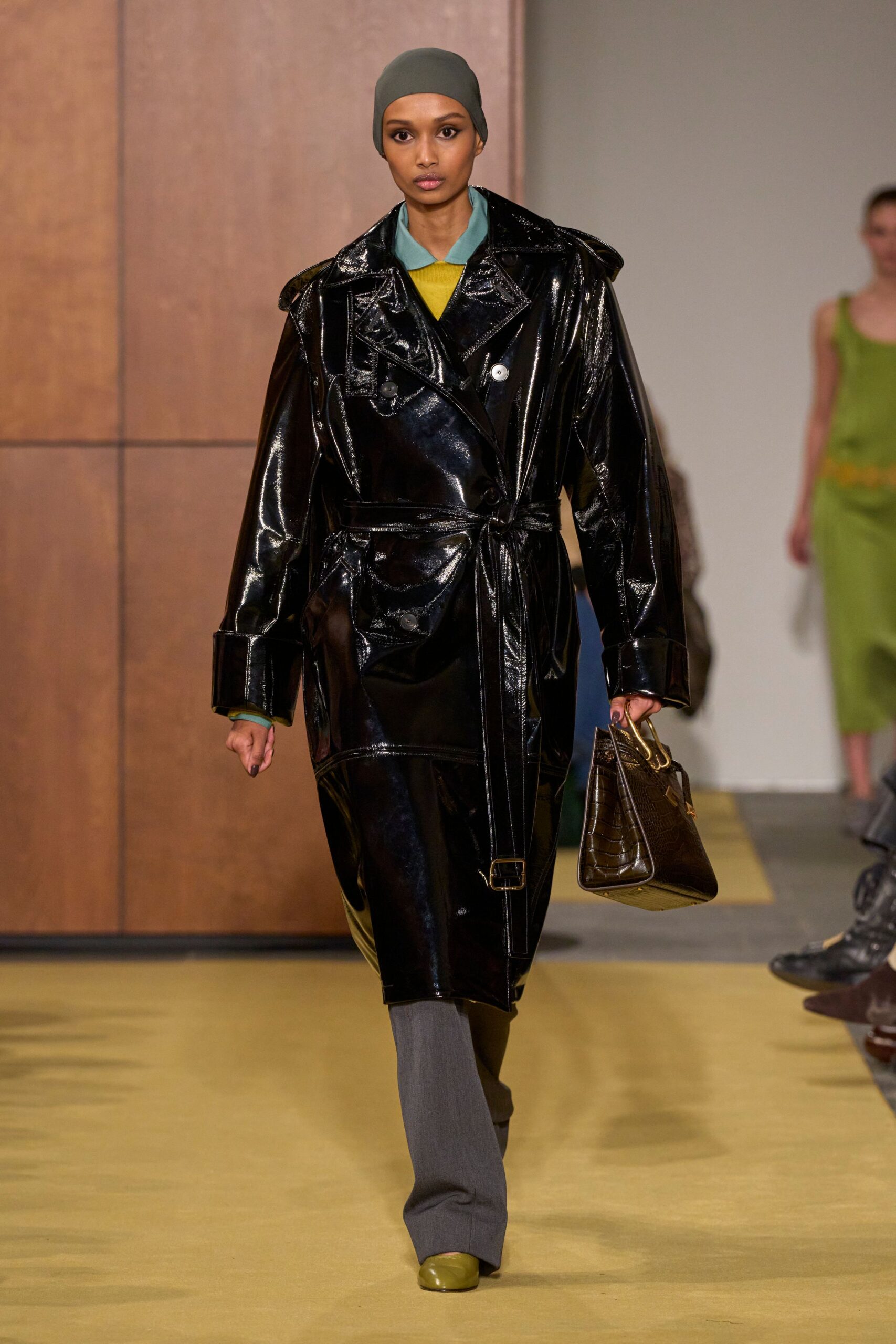 black vinyl long-sleeve collared oversized belted zippered coat