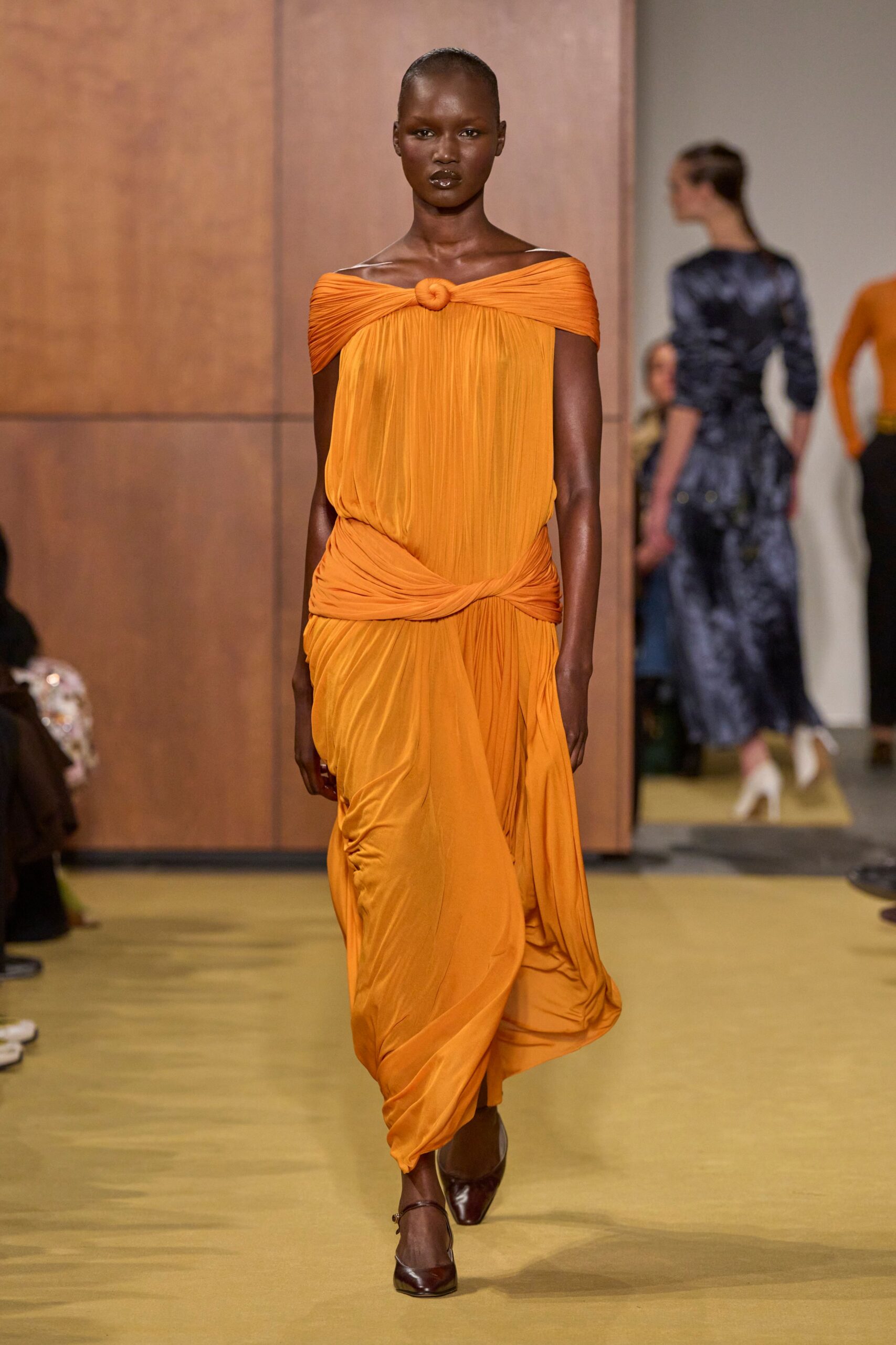 orange silk sleeveless off-shoulder fitted draped flowing dress