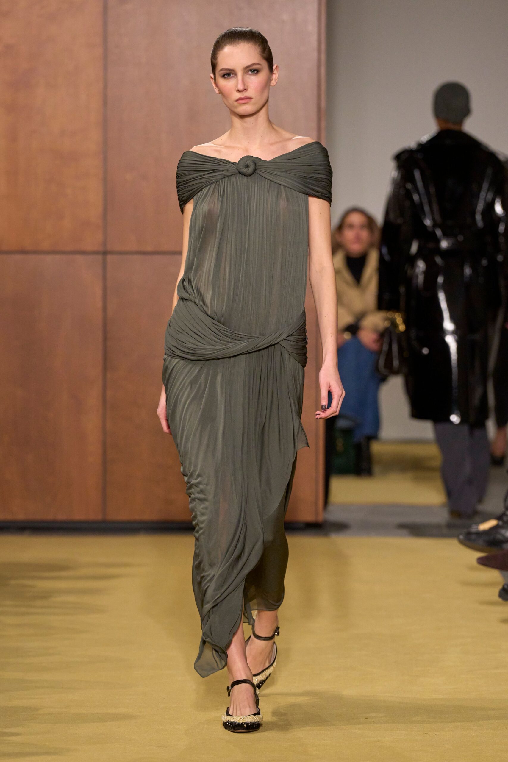 green silk sleeveless off-shoulder fitted draped flowing dress