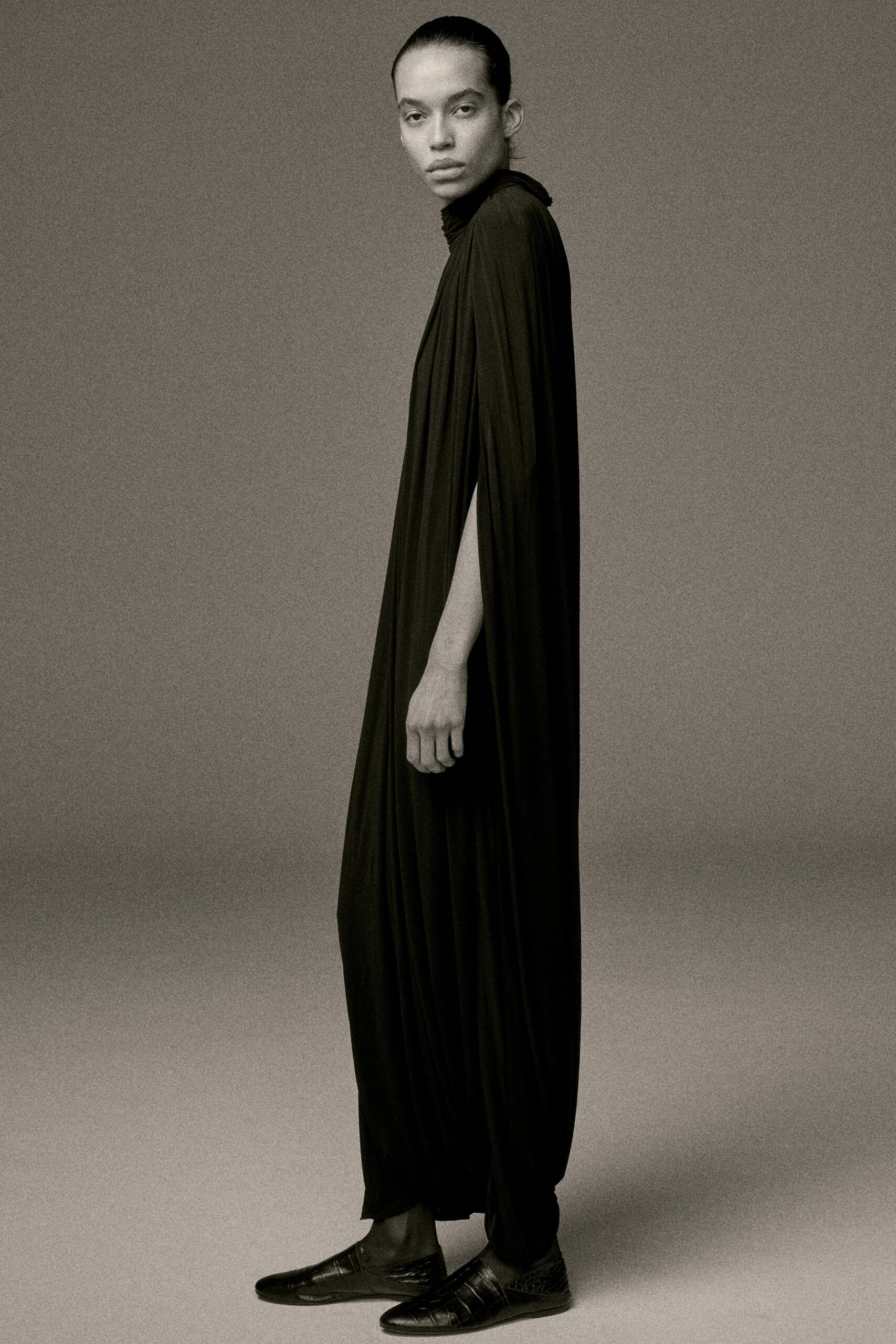 black silk long-sleeve high-neck relaxed draped flowing gown