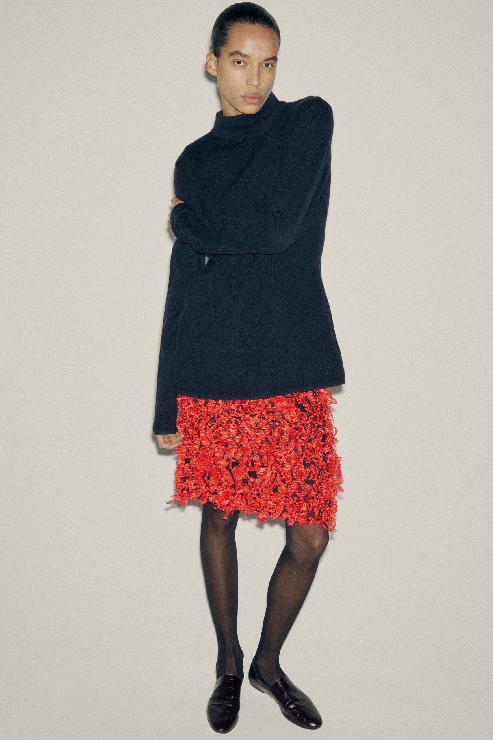 black wool long-sleeve high-neck relaxed top