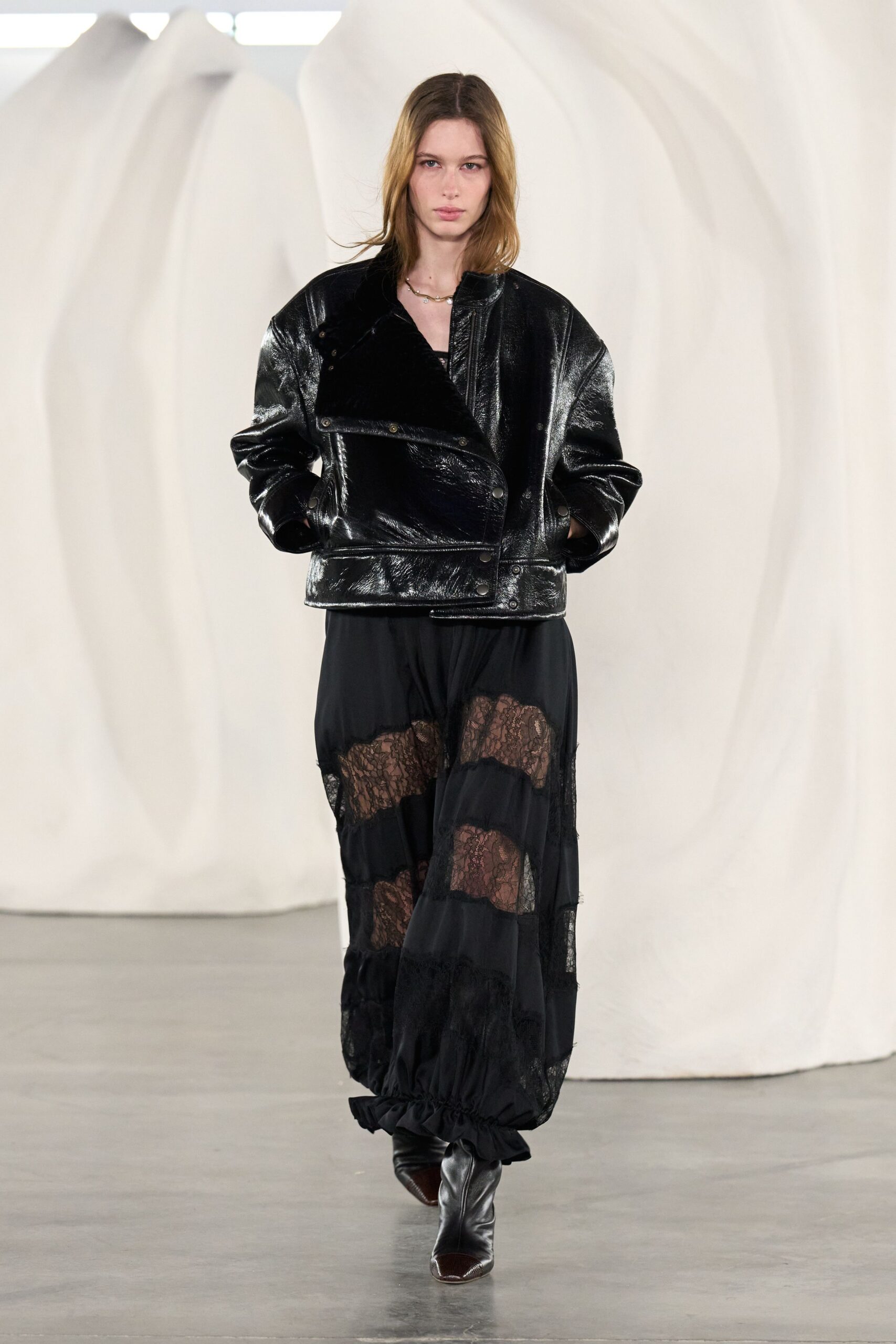 black leather long-sleeve collared fitted zippered shiny jacket
