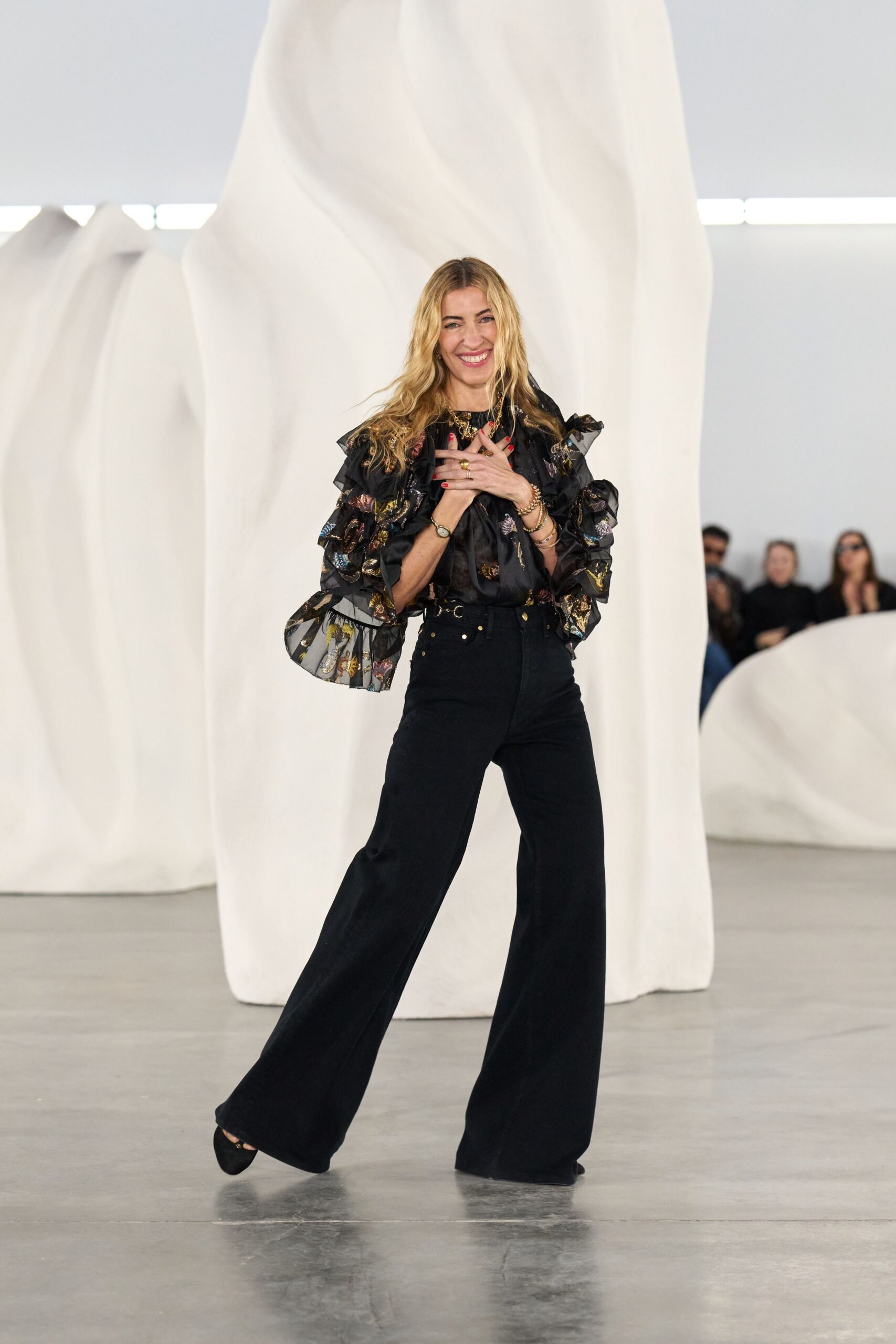 black ruffled top with wide-leg pants