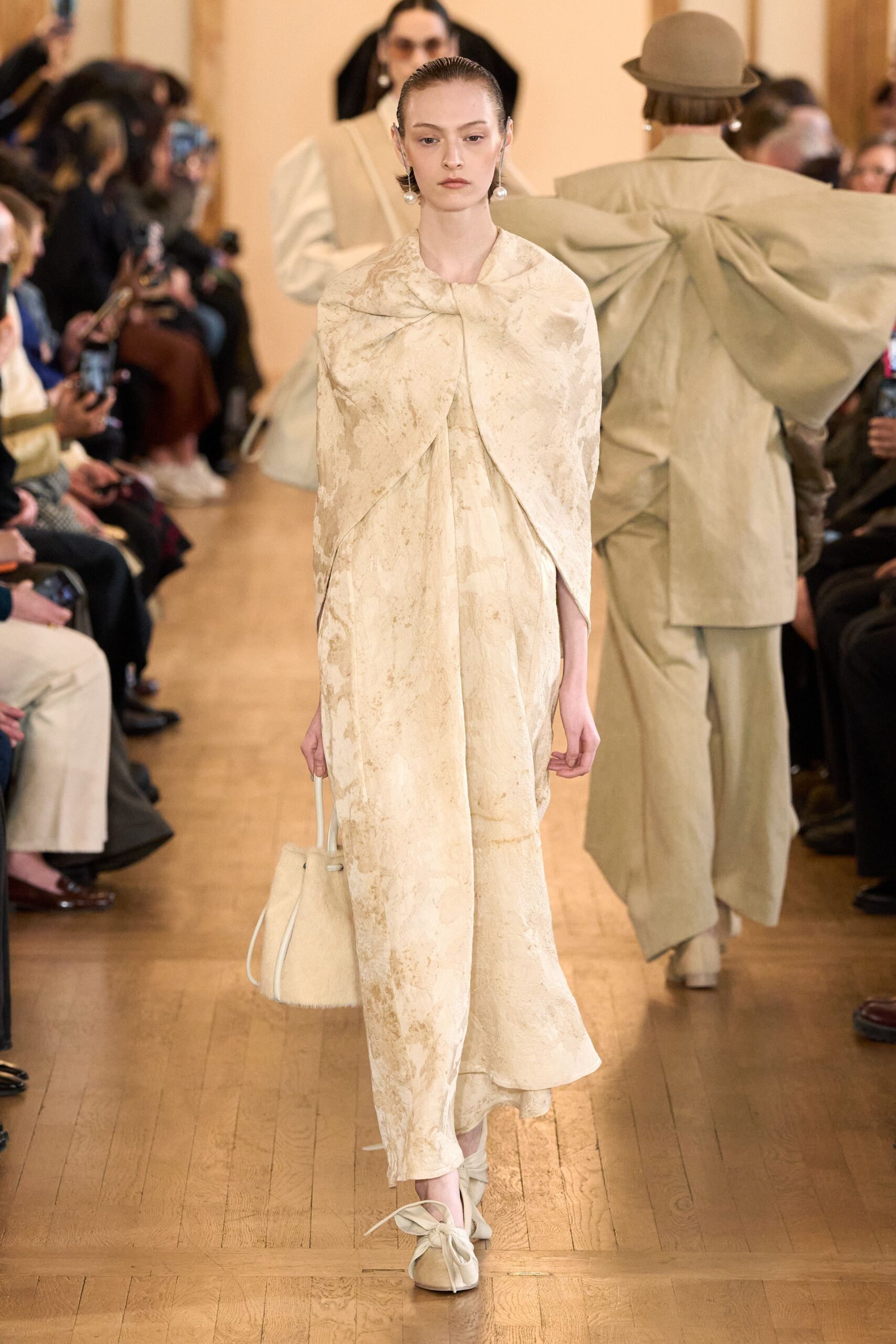 beige silk sleeveless v-neck fitted draped flowing dress