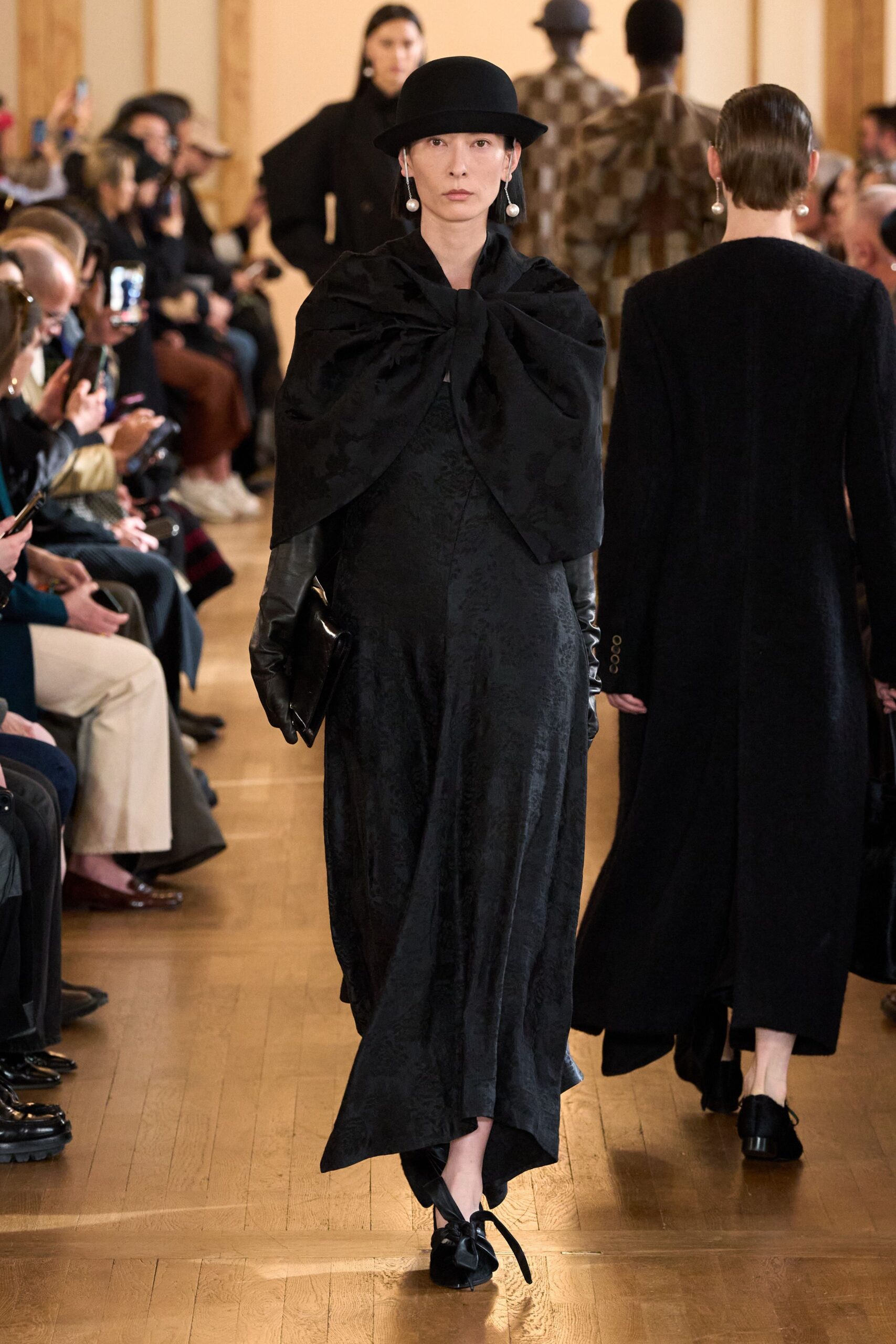 black fitted gown with cape