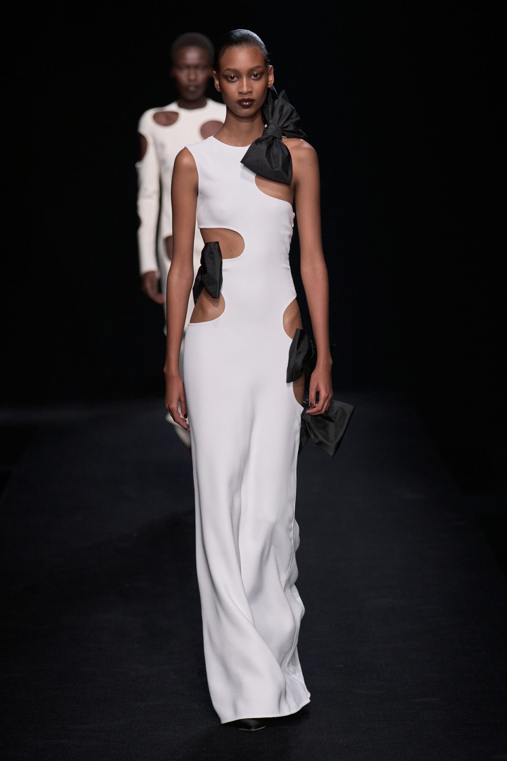 white fitted gown with cutouts