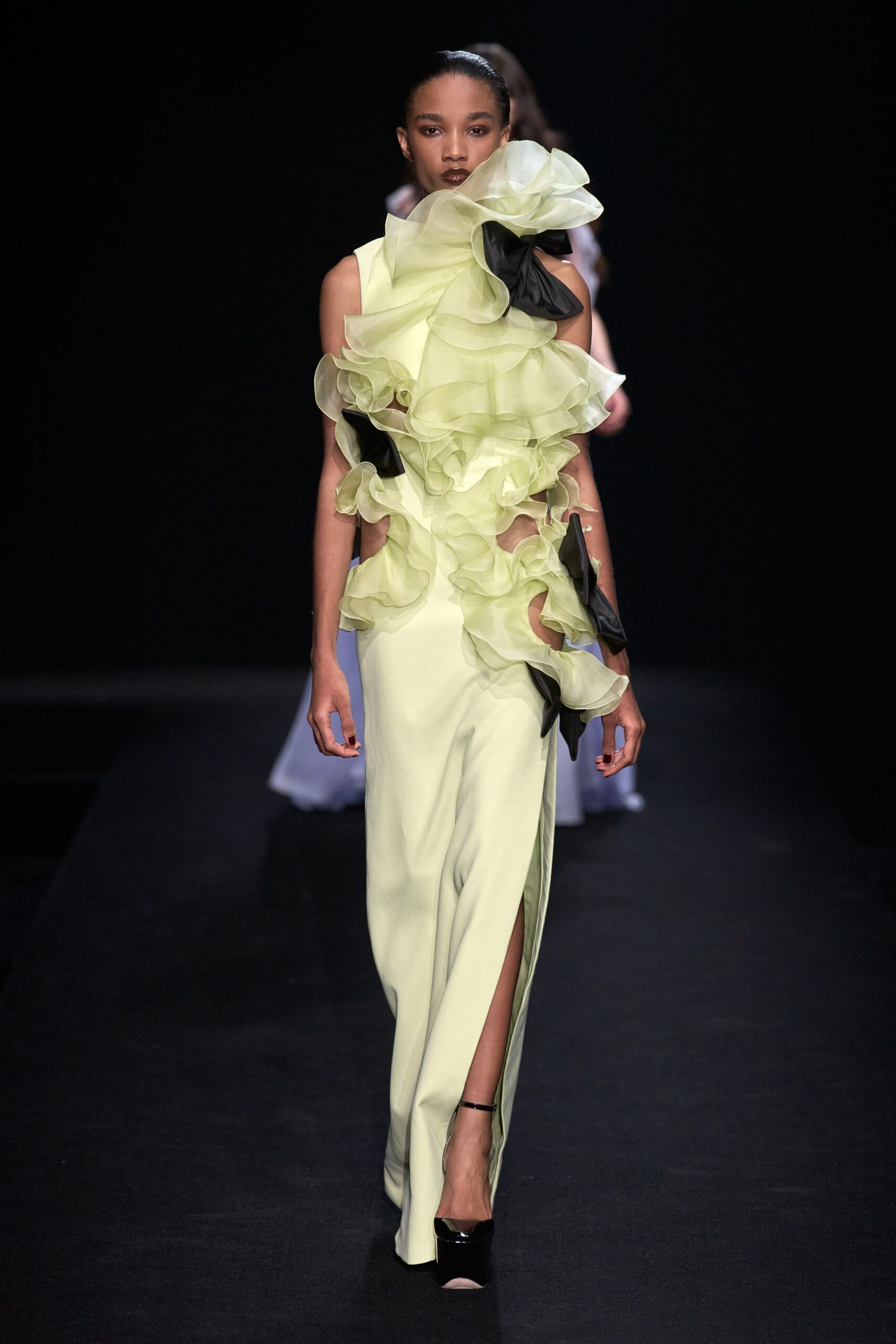 yellow silk ruffled gown with slit