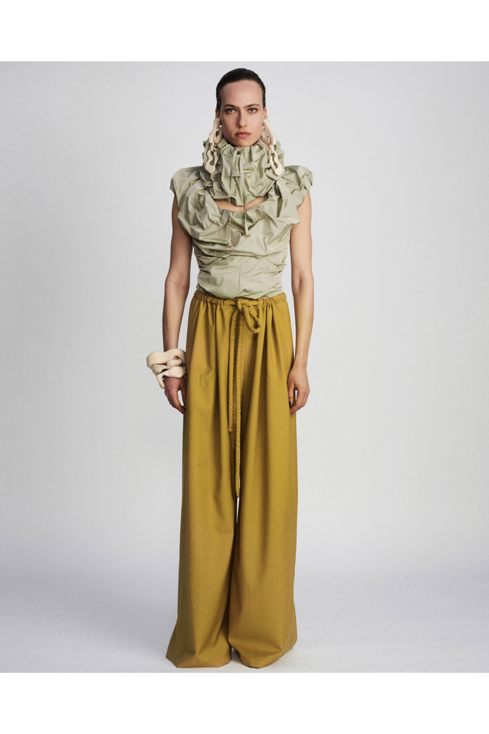 green cotton sleeveless high-neck fitted ruffled top