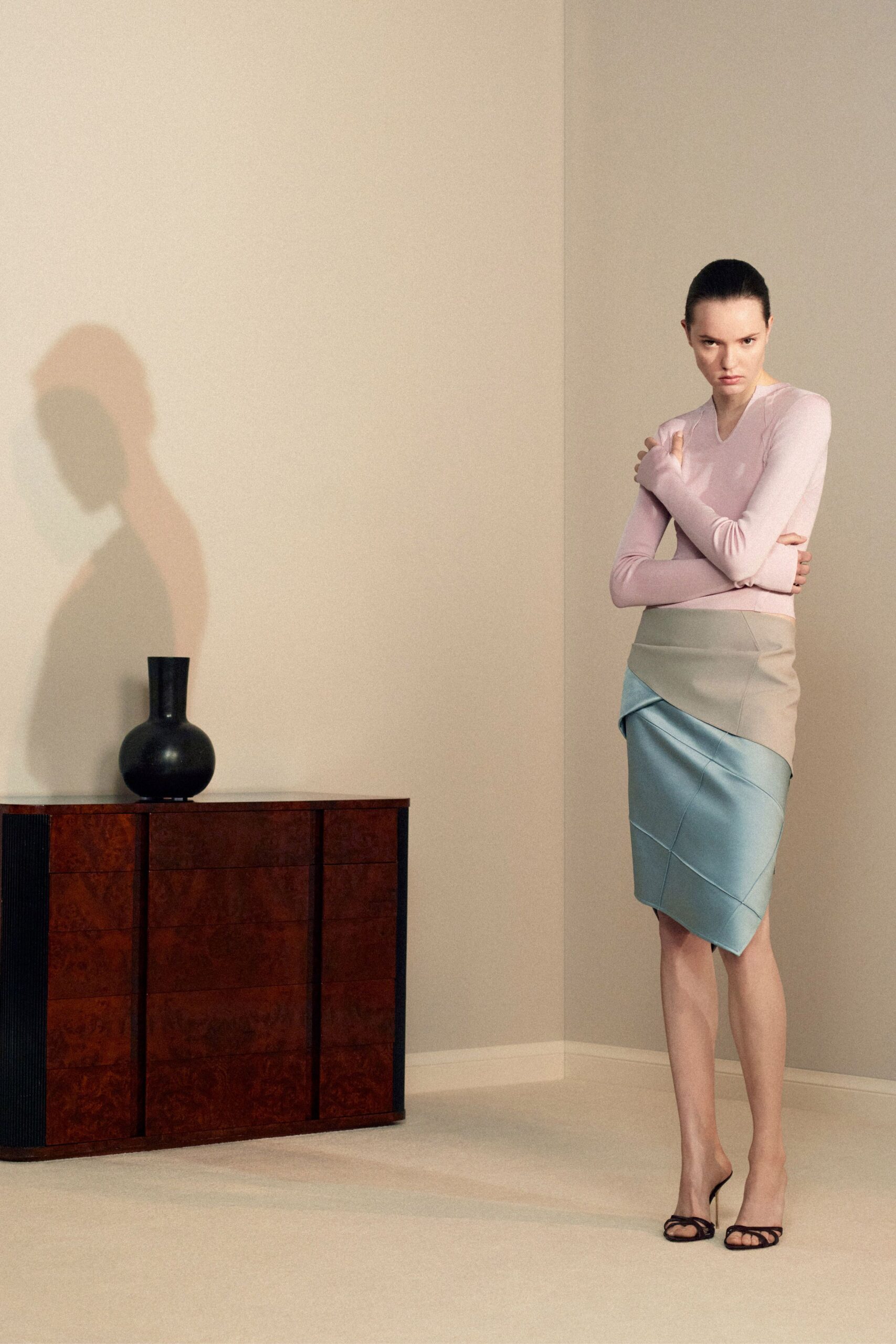 pink fitted top beige blue skirt
