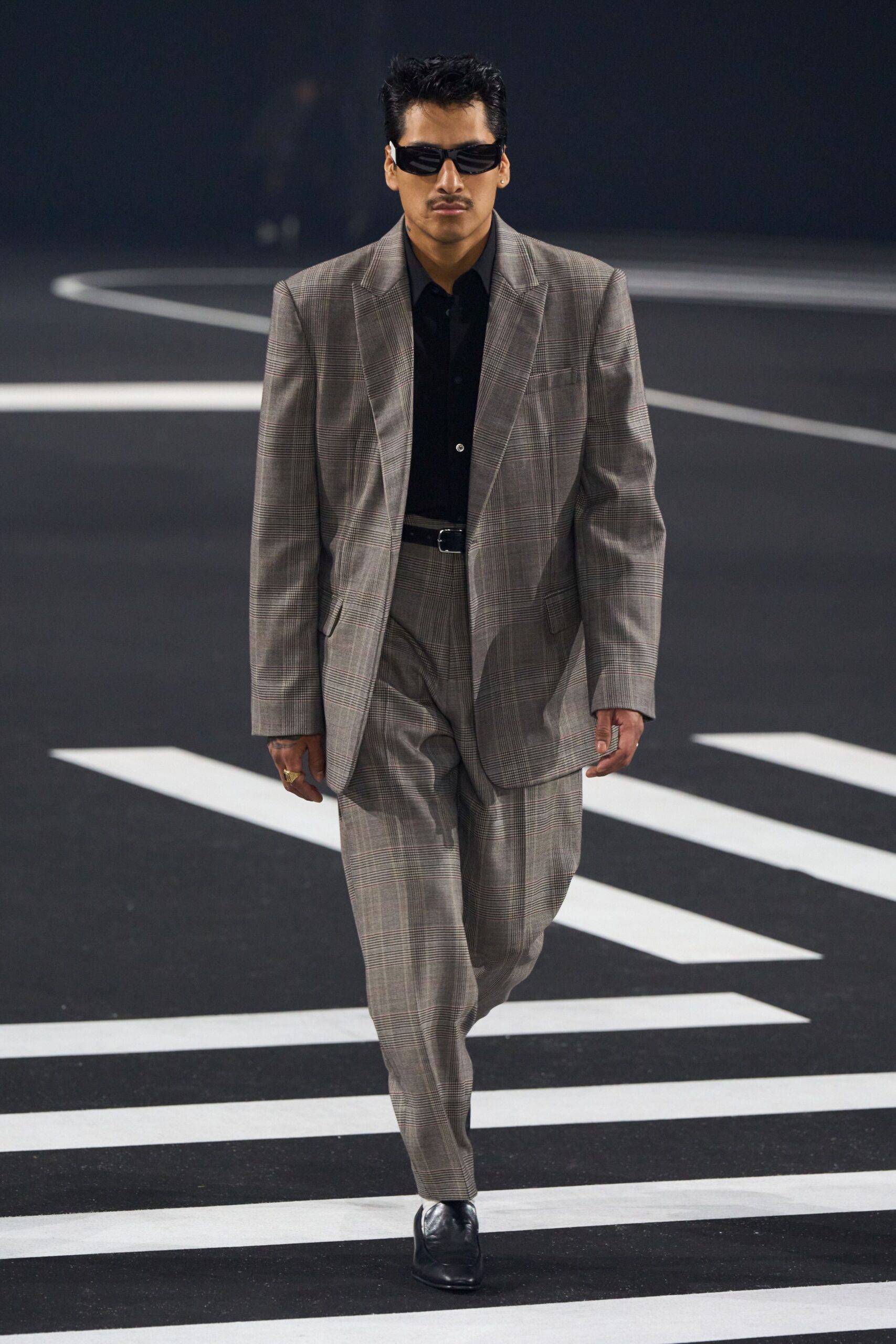 gray tailored suit with black shirt