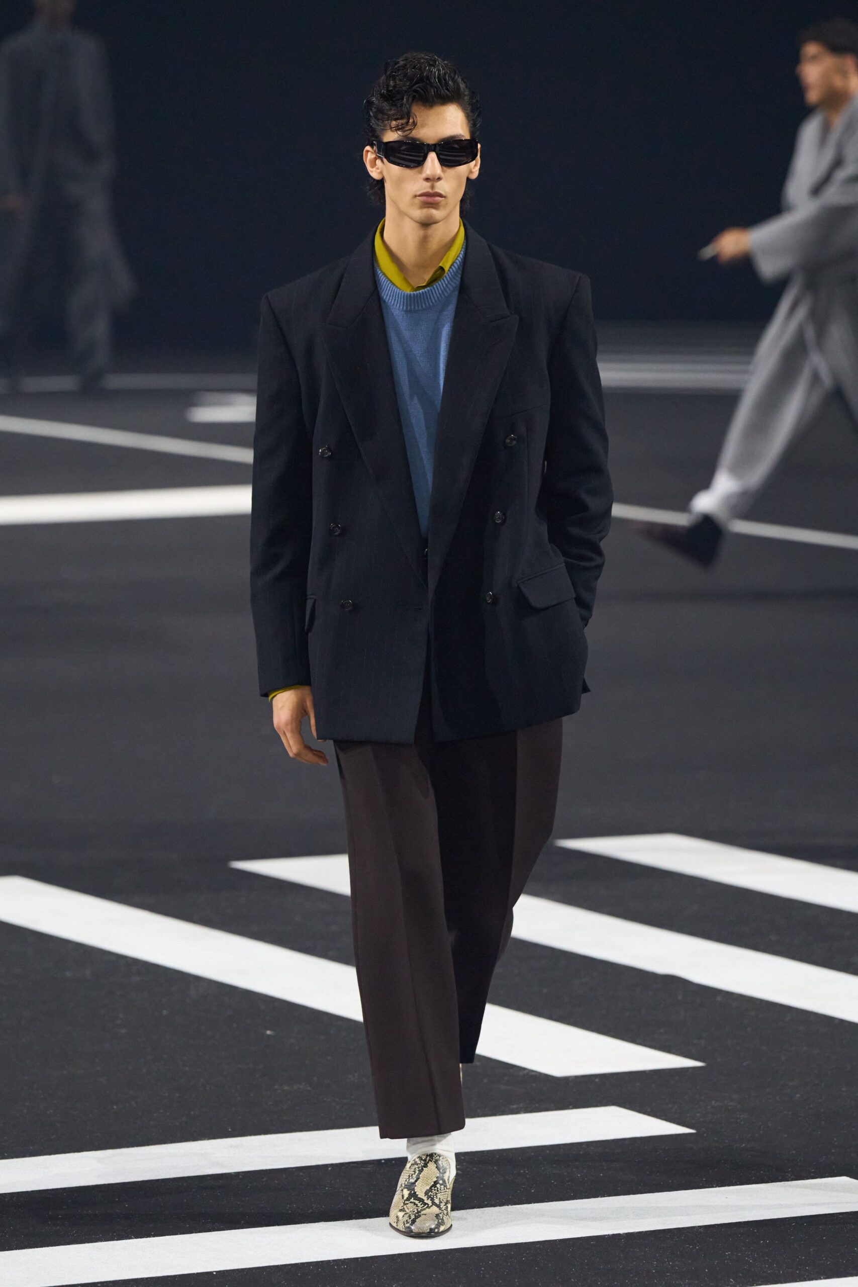 black blazer blue sweater brown pants