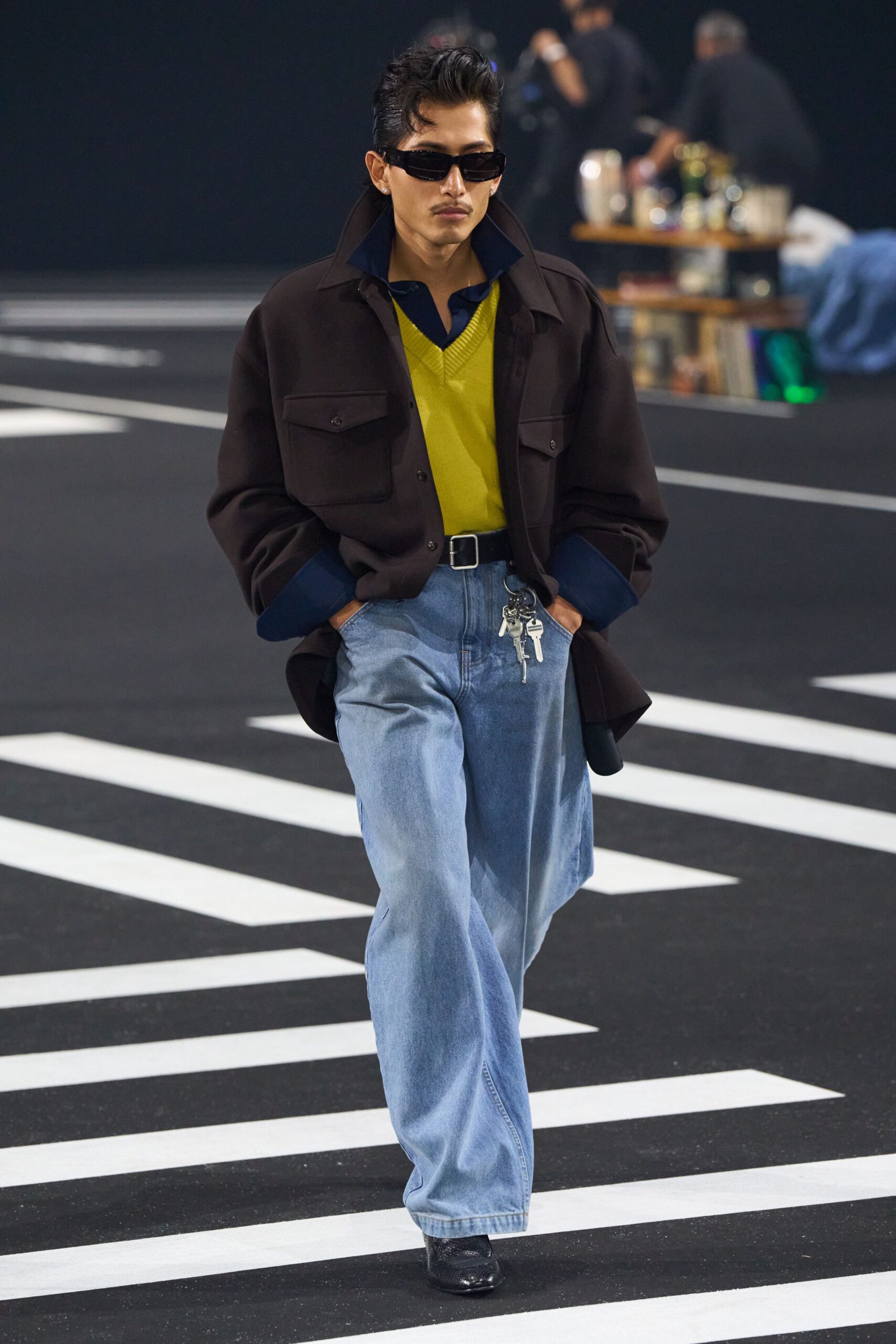 black jacket green shirt blue pants