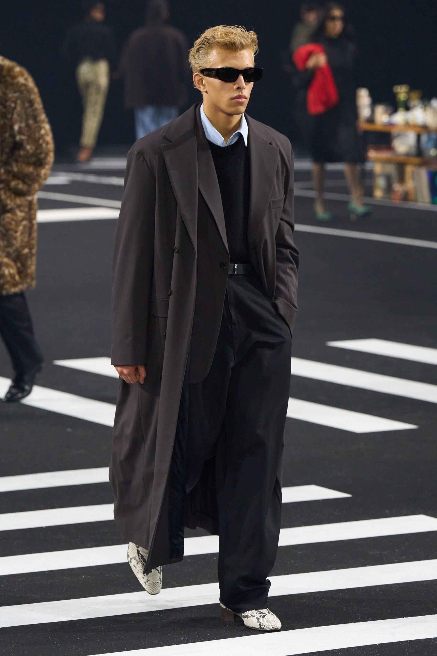 black wool coat with sweater and tailored pants