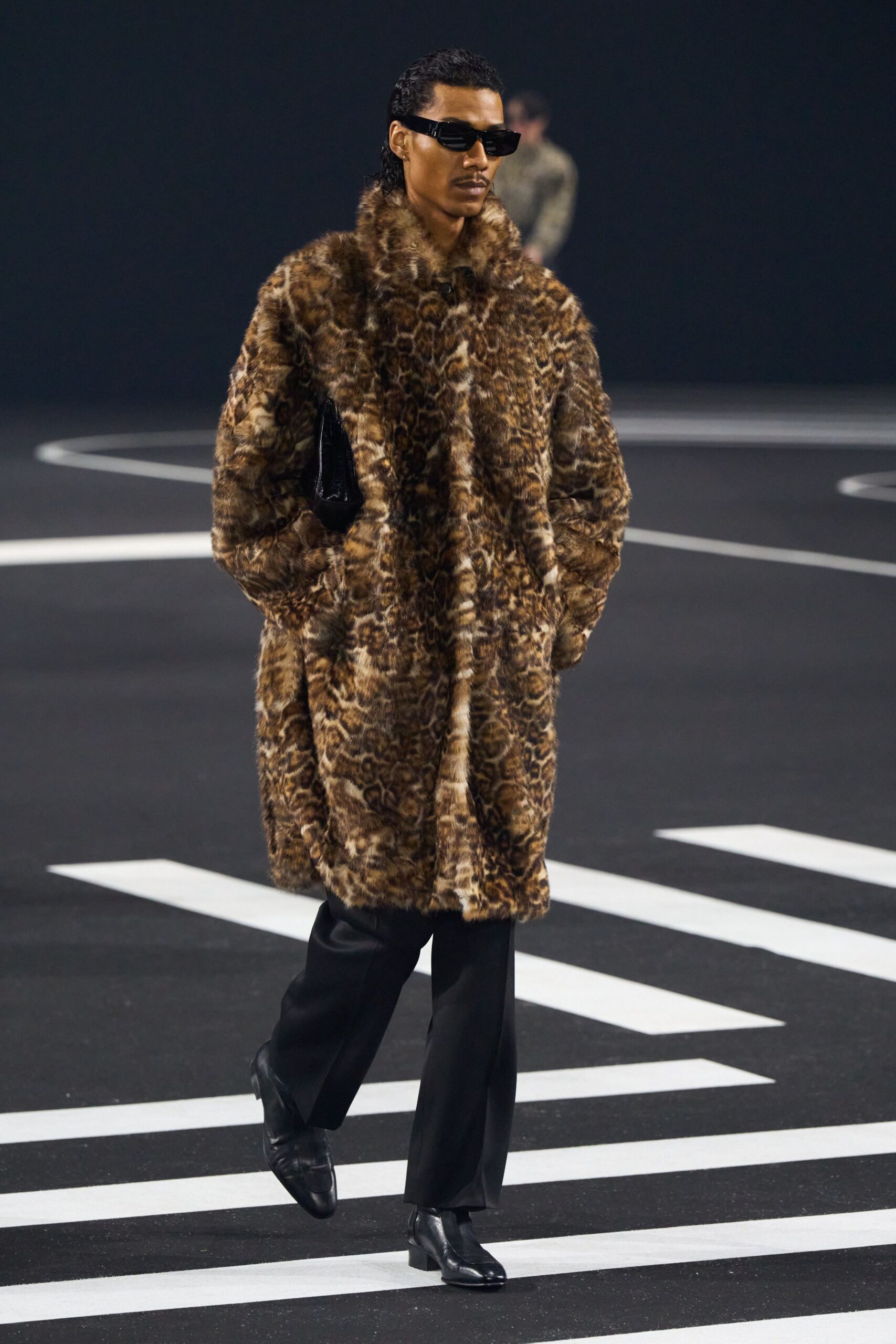 brown faux-fur coat with black pants